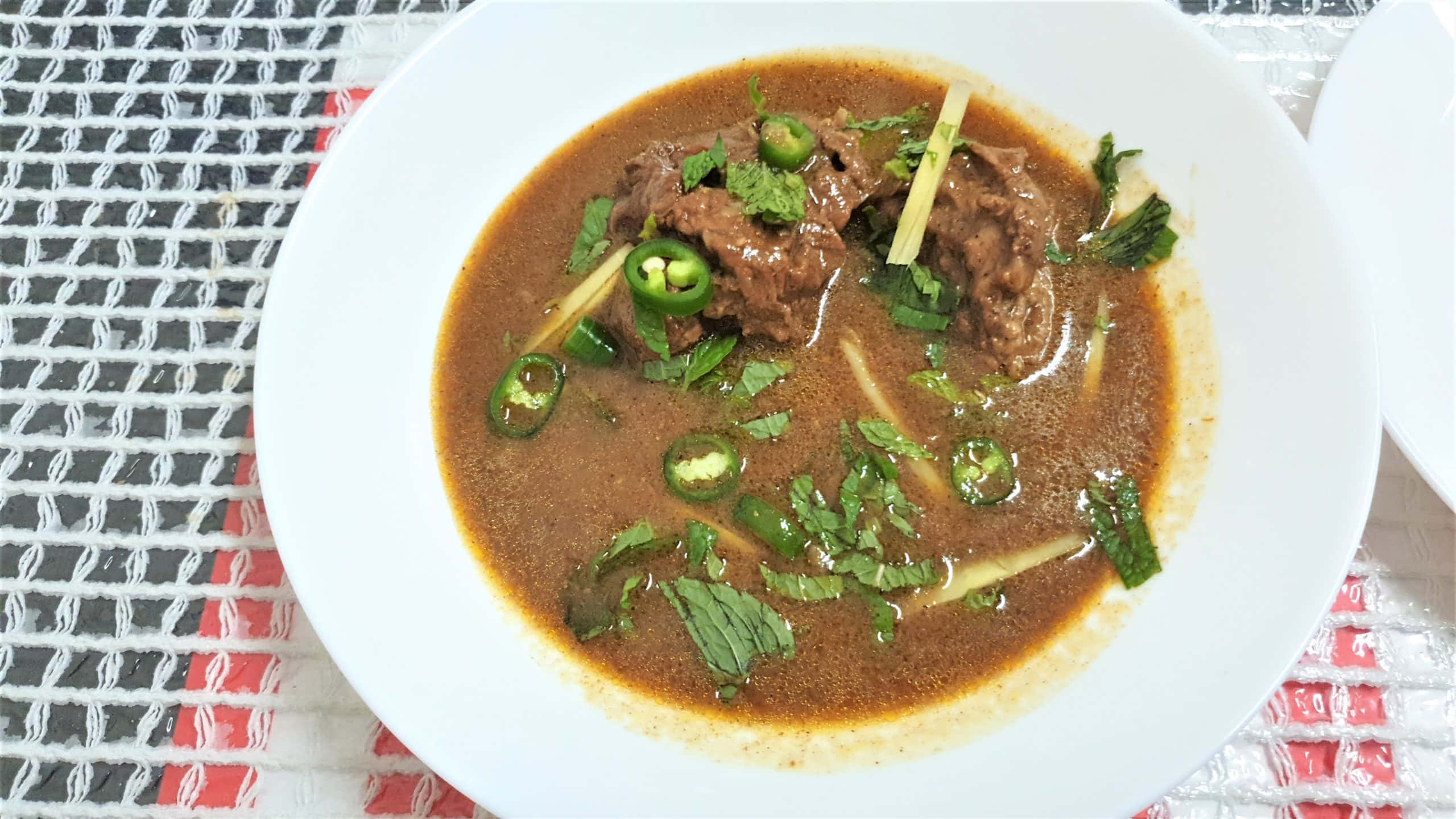 Nihari, white bowl, patterned mat, 2K Desktop Wallpaper