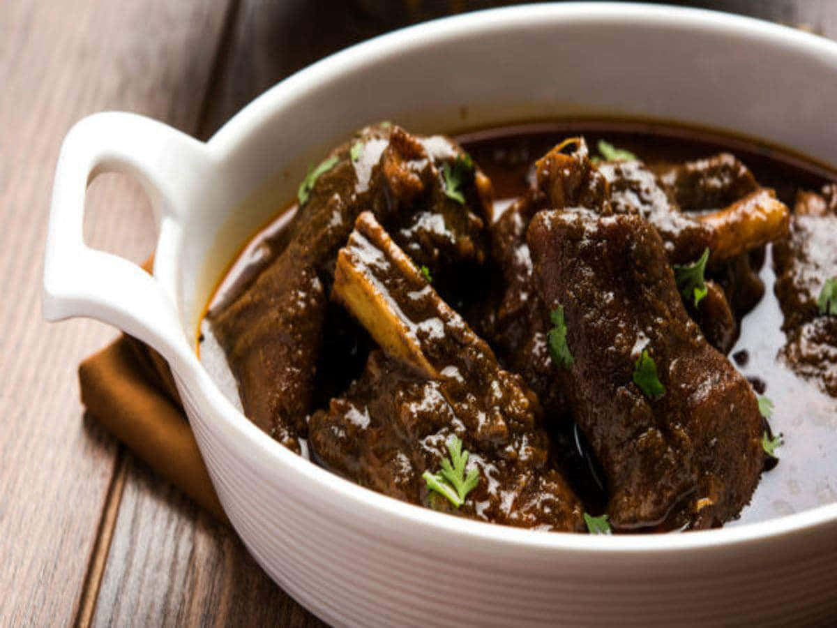 Nihari, white ceramic bowl, wooden surface, SD Desktop Wallpaper
