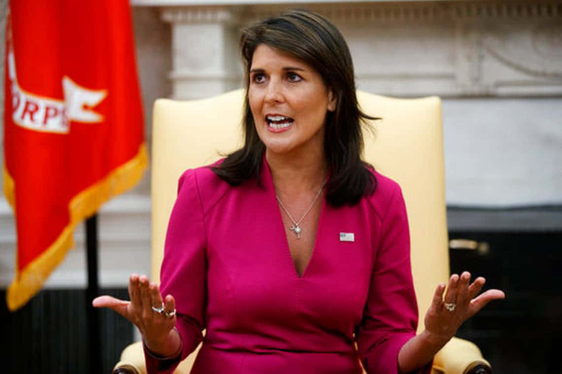 Nikki Haley, magenta suit, yellow chair, SD Desktop Wallpaper