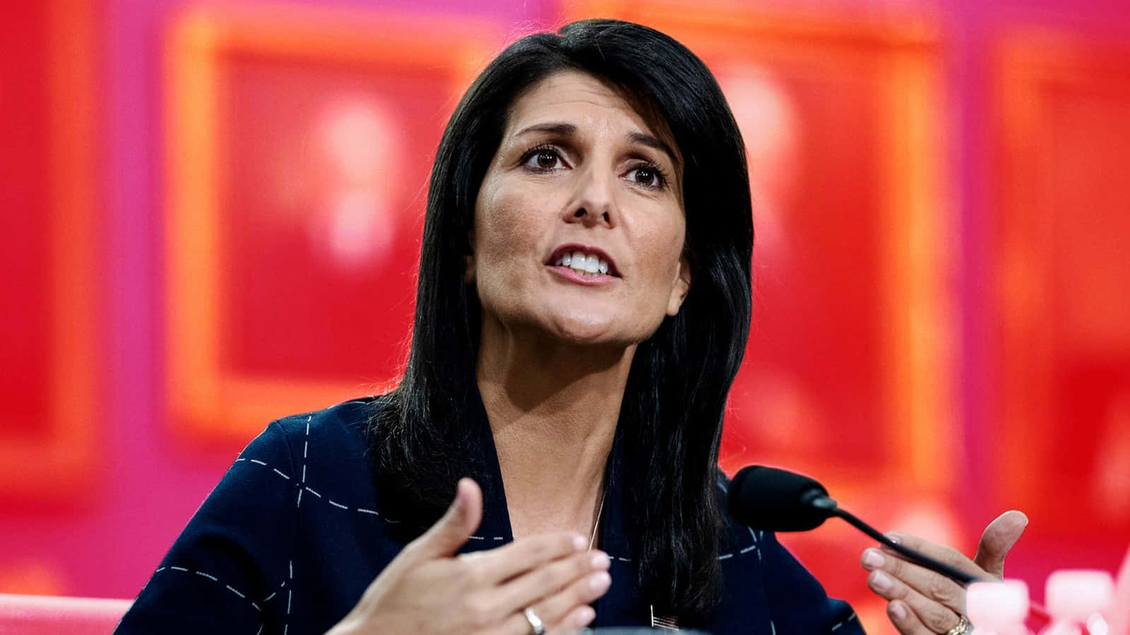 Nikki Haley, microphone, vibrant red background, HD Desktop Wallpaper