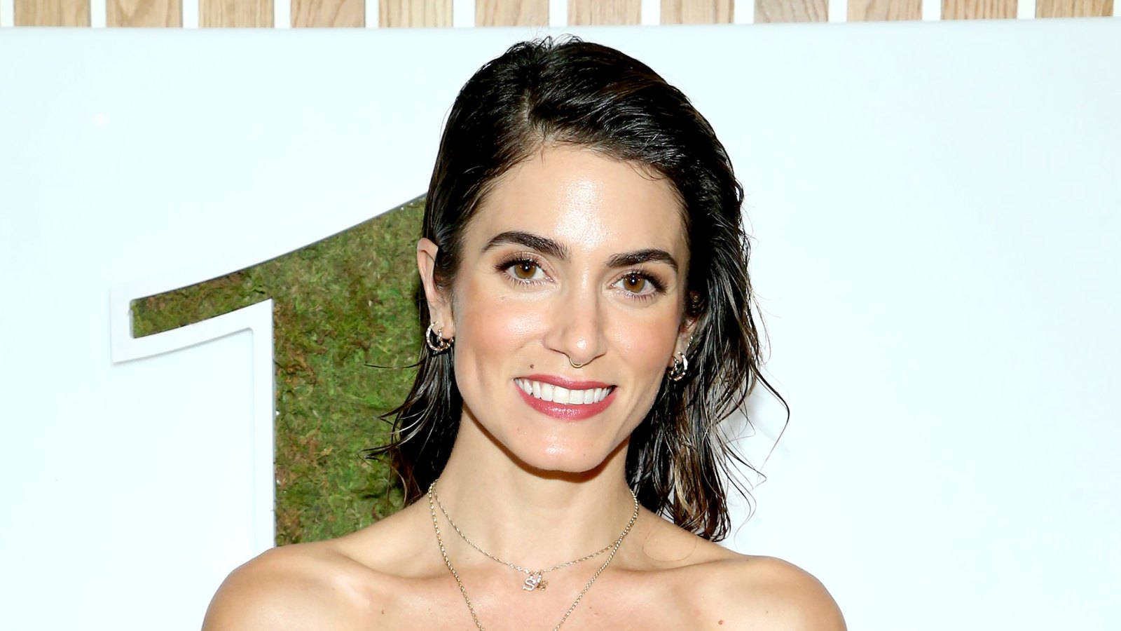Nikki Reed, green moss-covered number one sign, white wall, HD Desktop Wallpaper