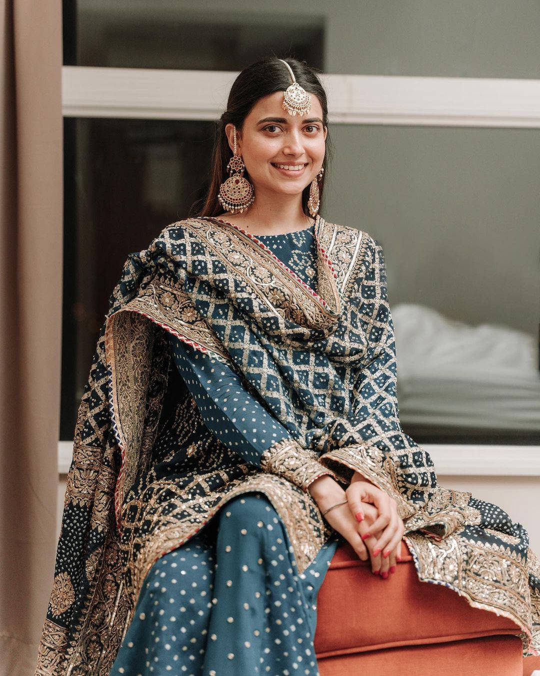 Nimrat Khaira, blue and gold embroidered traditional attire, red cushion, HD Phone Wallpaper