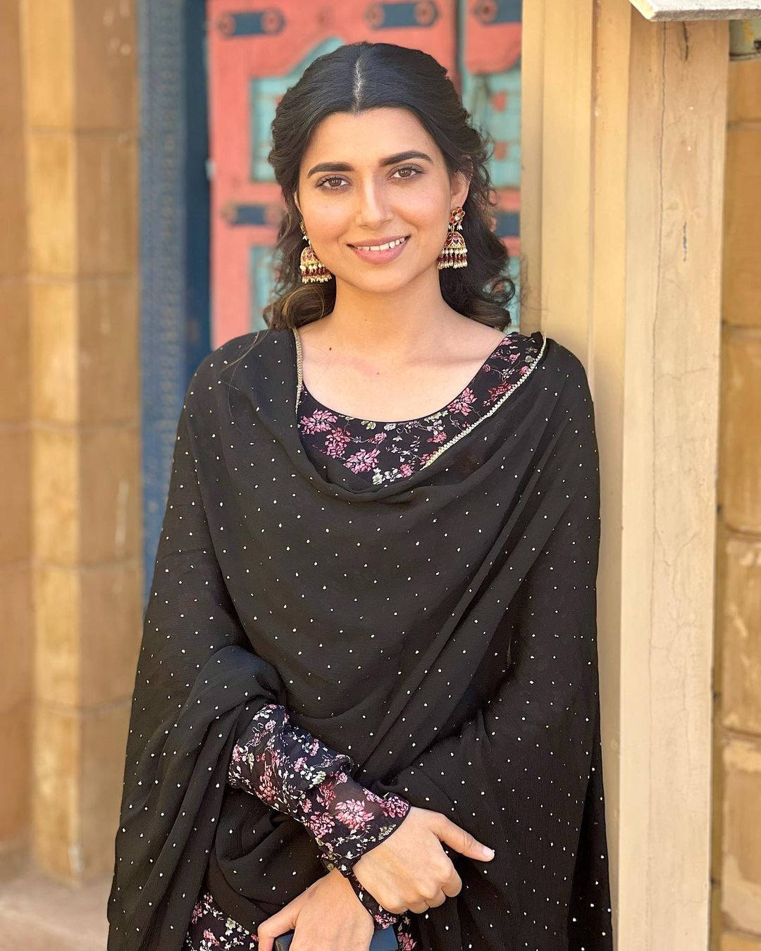 Nimrat Khaira, black floral embroidered outfit, rustic wooden door, HD Phone Wallpaper