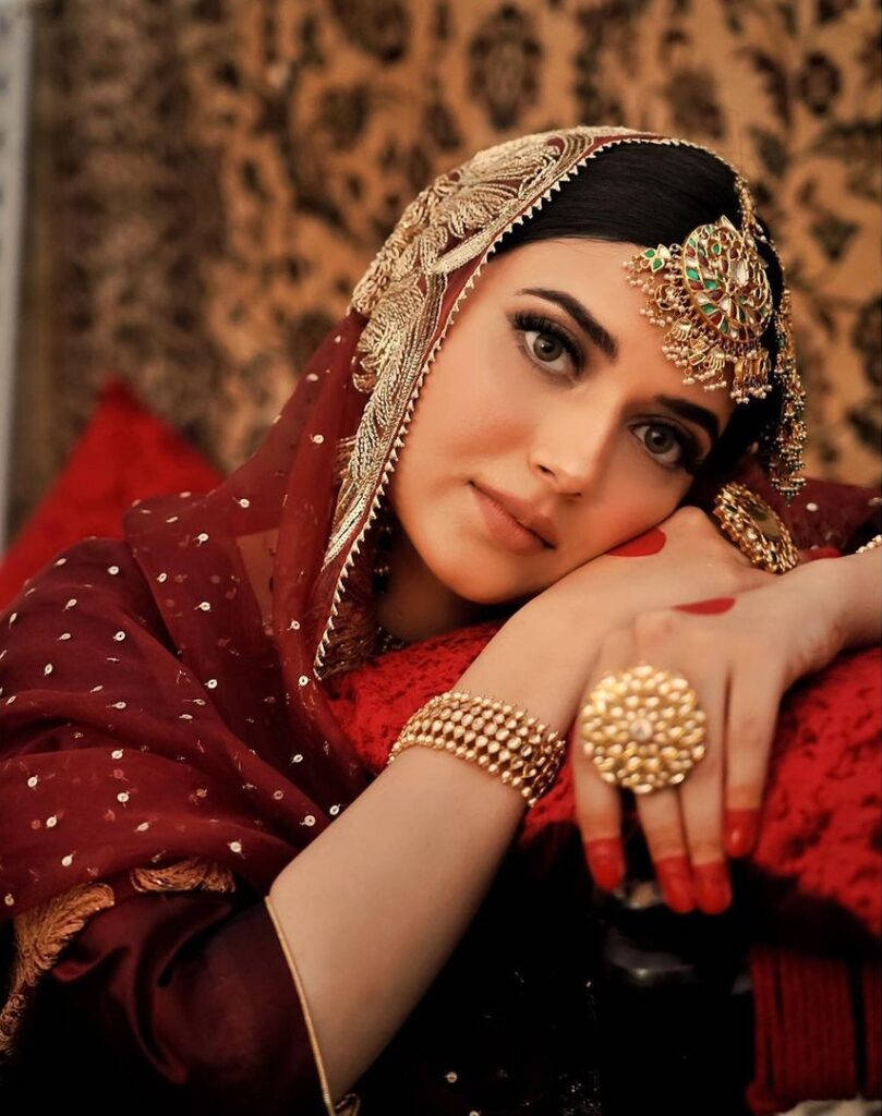 Nimrat Khaira, gold jewelry, ornate red bridal attire, SD Phone Wallpaper