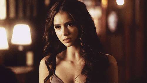 Nina Dobrev, long dark hair, warmly lit dim room, SD Desktop Wallpaper
