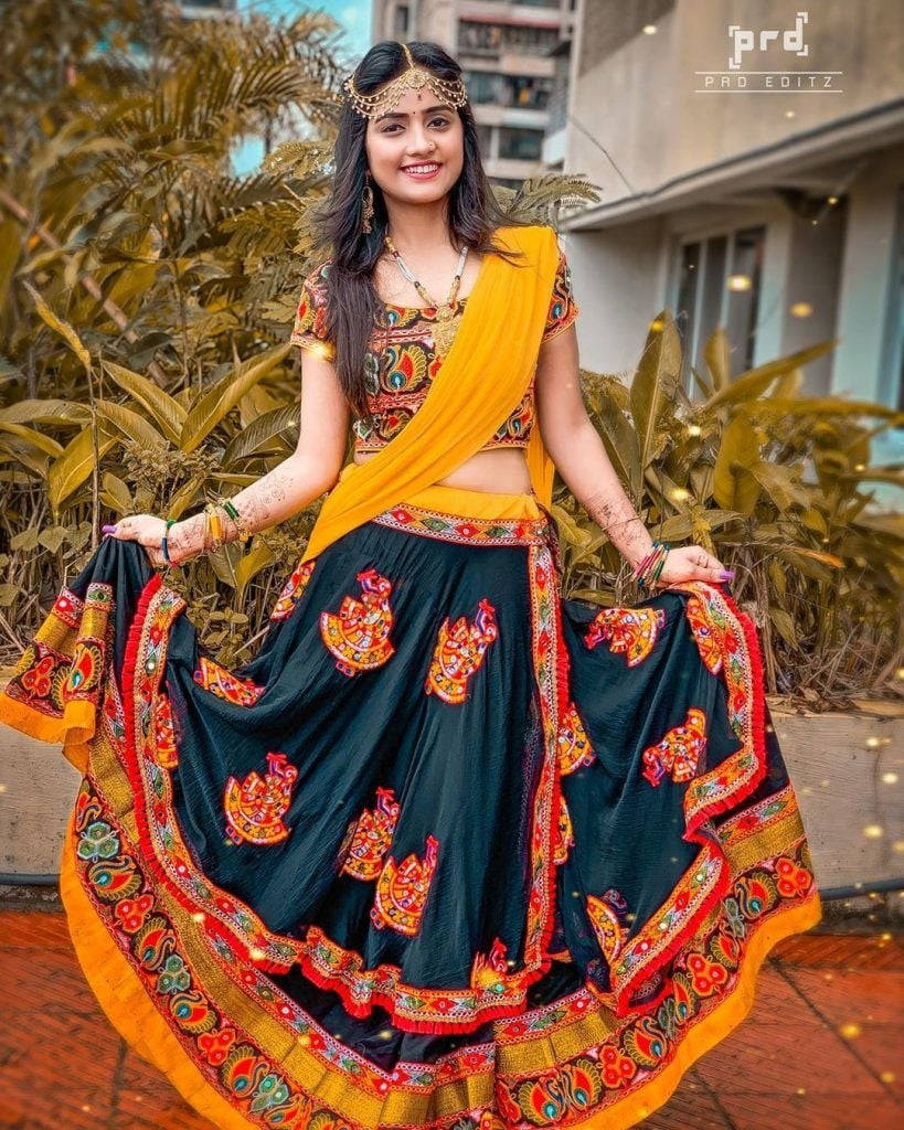 Nisha Guragain, vibrant yellow traditional Gujarati dress, gold and orange embroidery, SD Phone Wallpaper