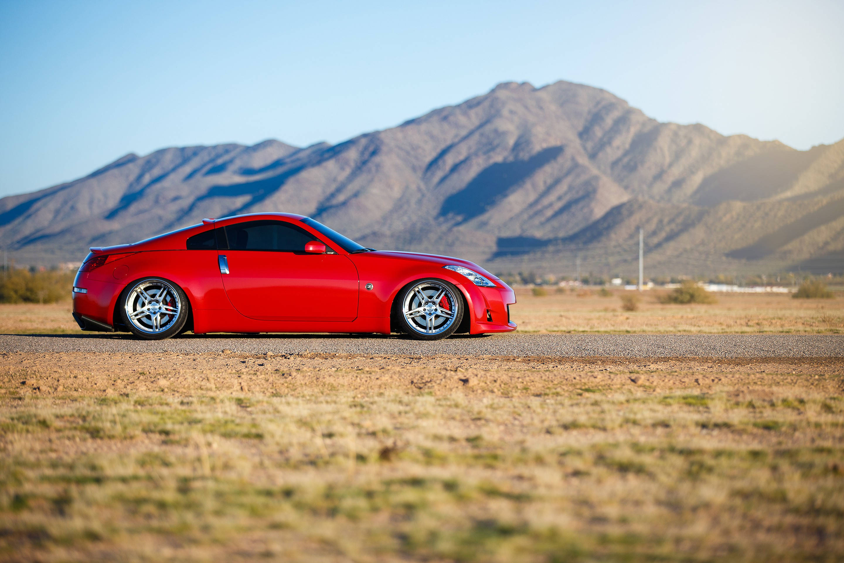 Nissan 350z, vibrant red, desert road, 2K Desktop Wallpaper