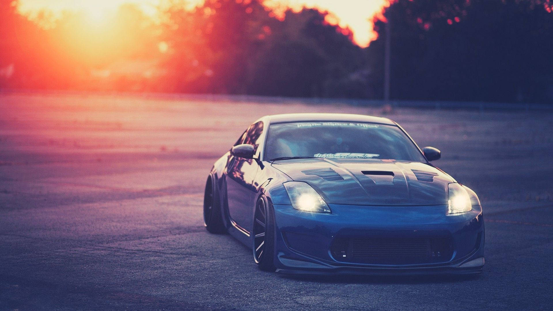 Nissan 350Z, sleek blue sports car, glowing headlights, Full HD Desktop Wallpaper