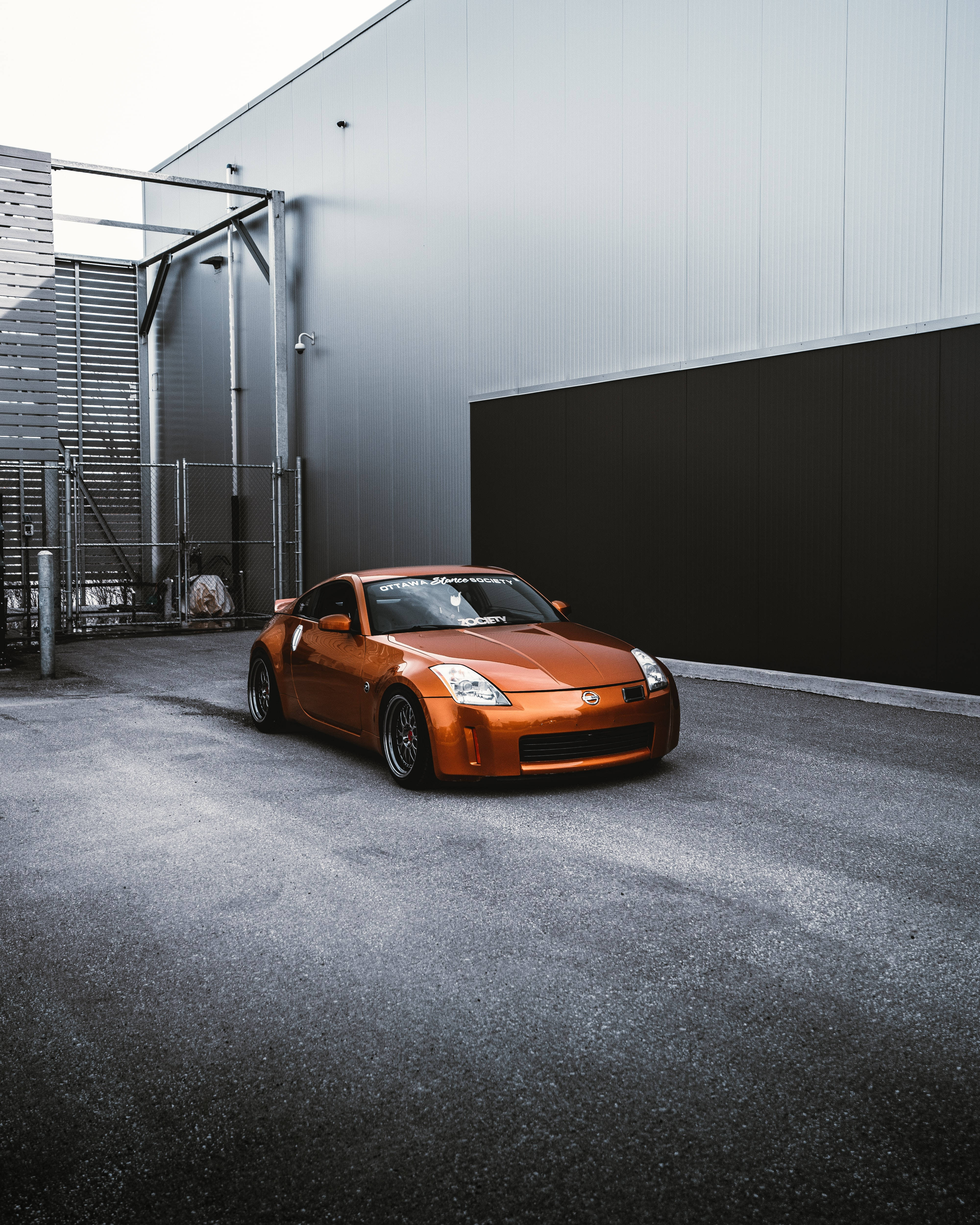 Nissan 350z, orange, modern industrial building, 4K Phone Wallpaper