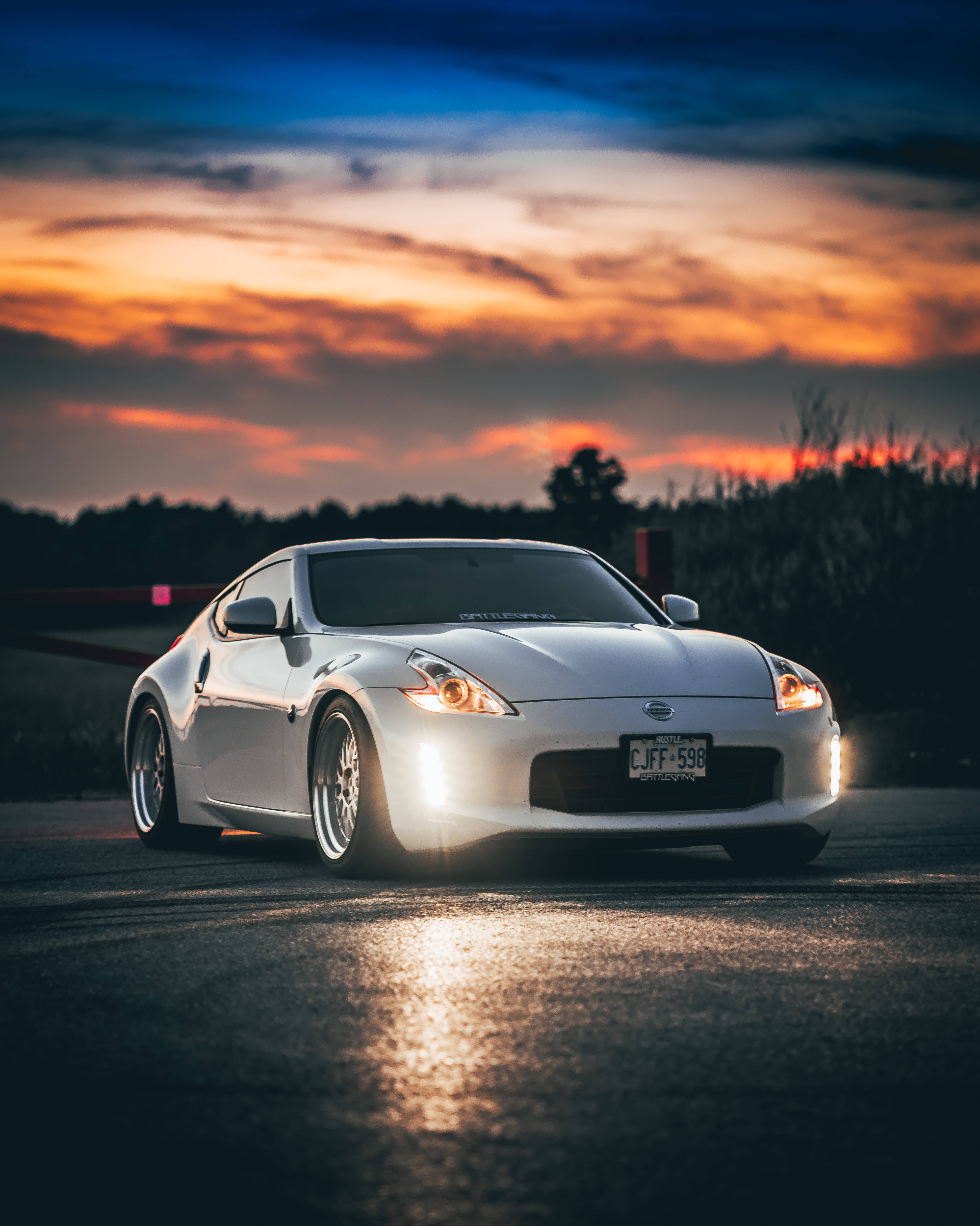 Nissan 370z, white sports car, fiery sunset sky, 4K Phone Wallpaper