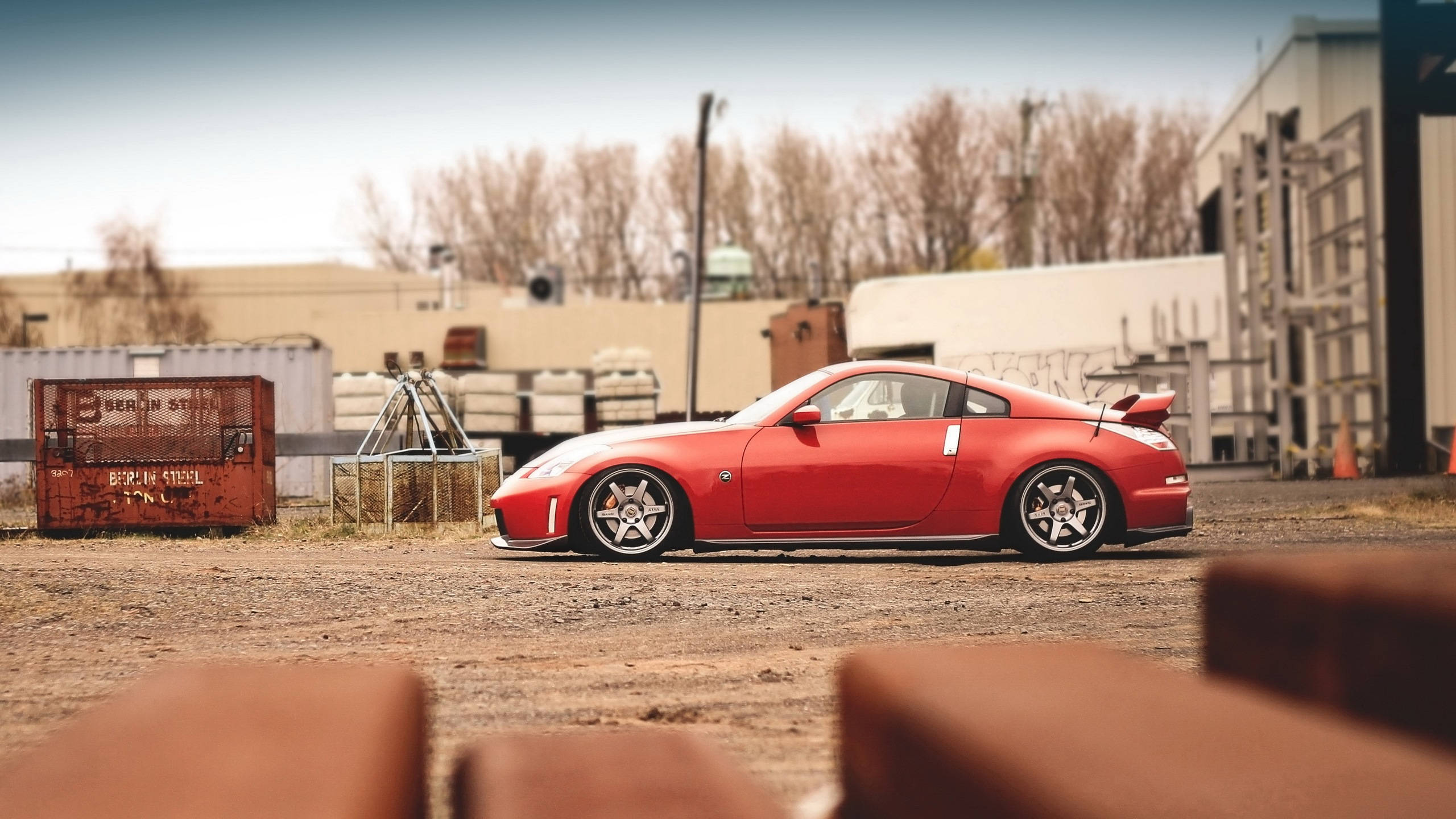 Nissan 370z, vibrant red, dusty ground, 2K Desktop Wallpaper