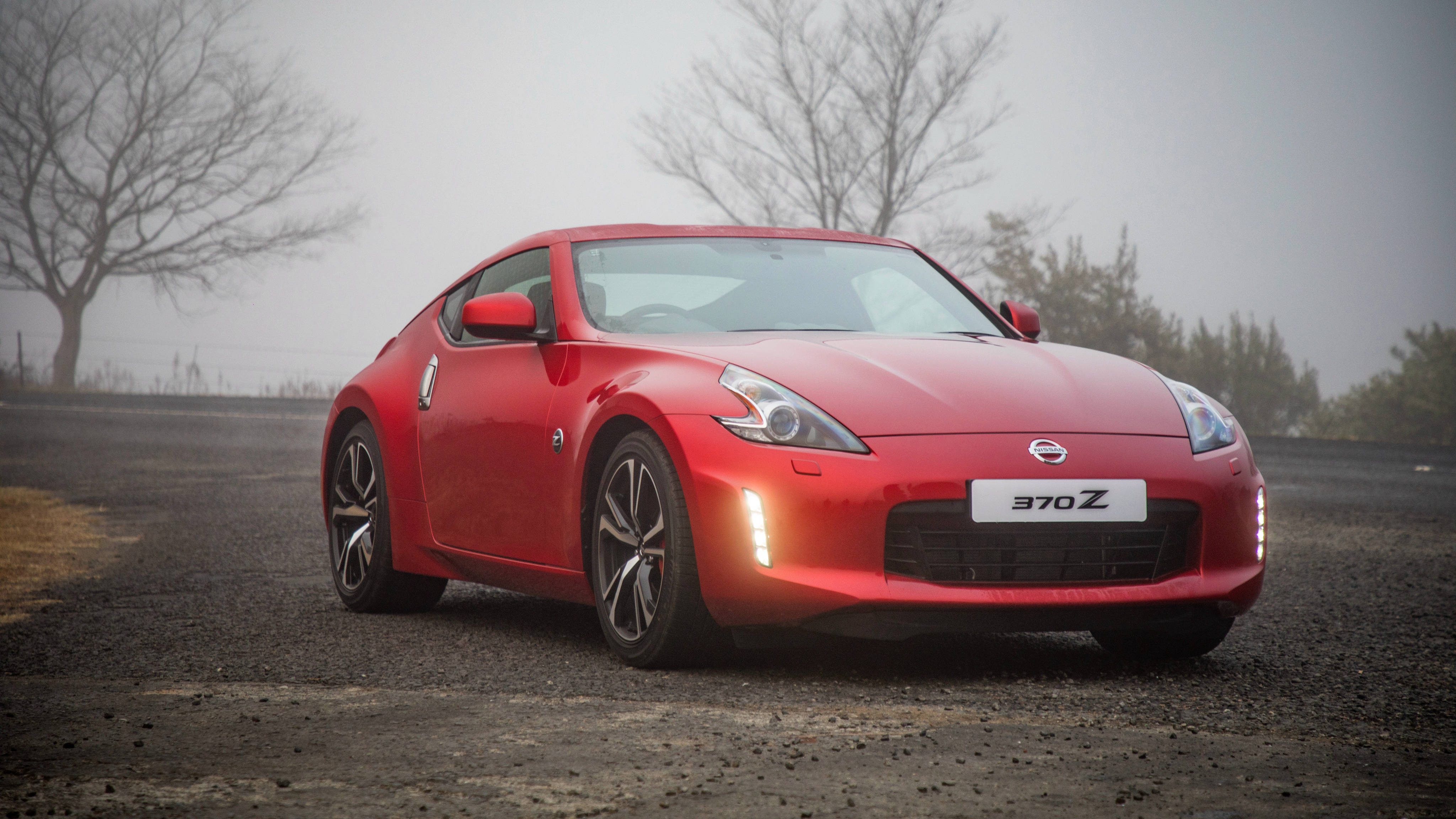 Nissan 370Z, vibrant red, misty gravel road, 4K Desktop Wallpaper