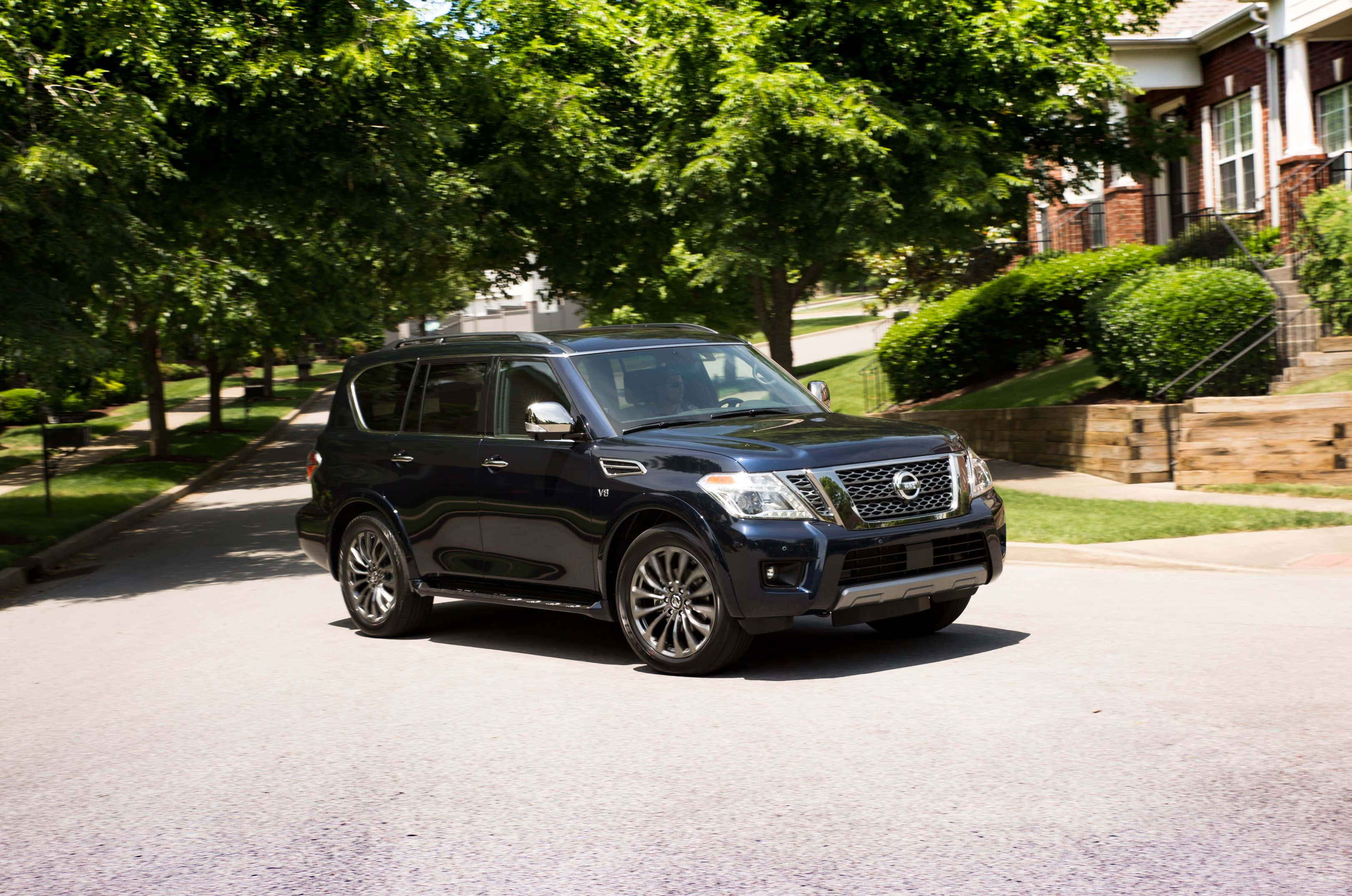 Nissan Armada, sleek black, tree-lined suburban street, 2K Desktop Wallpaper