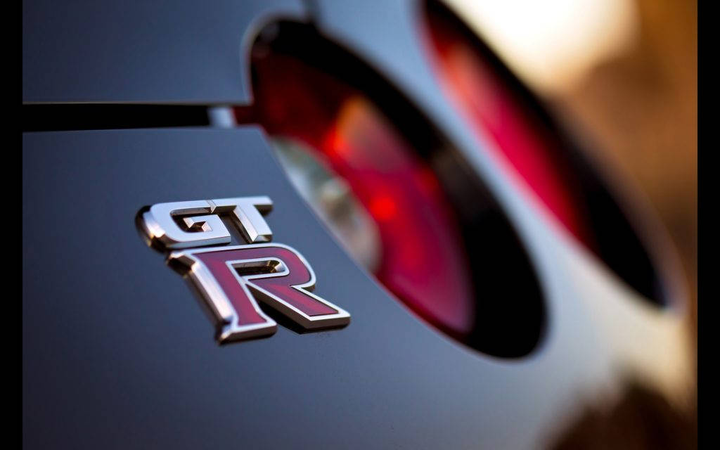 Nissan GT-R, emblem, sleek black car, SD Desktop Wallpaper