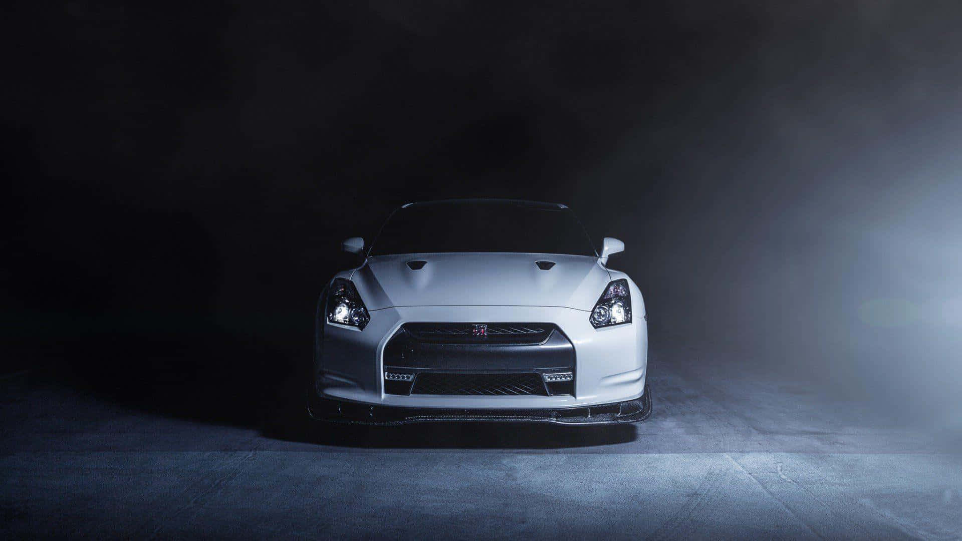 Nissan GTR, sleek silver sports car, dramatic spotlight, Full HD Desktop Wallpaper
