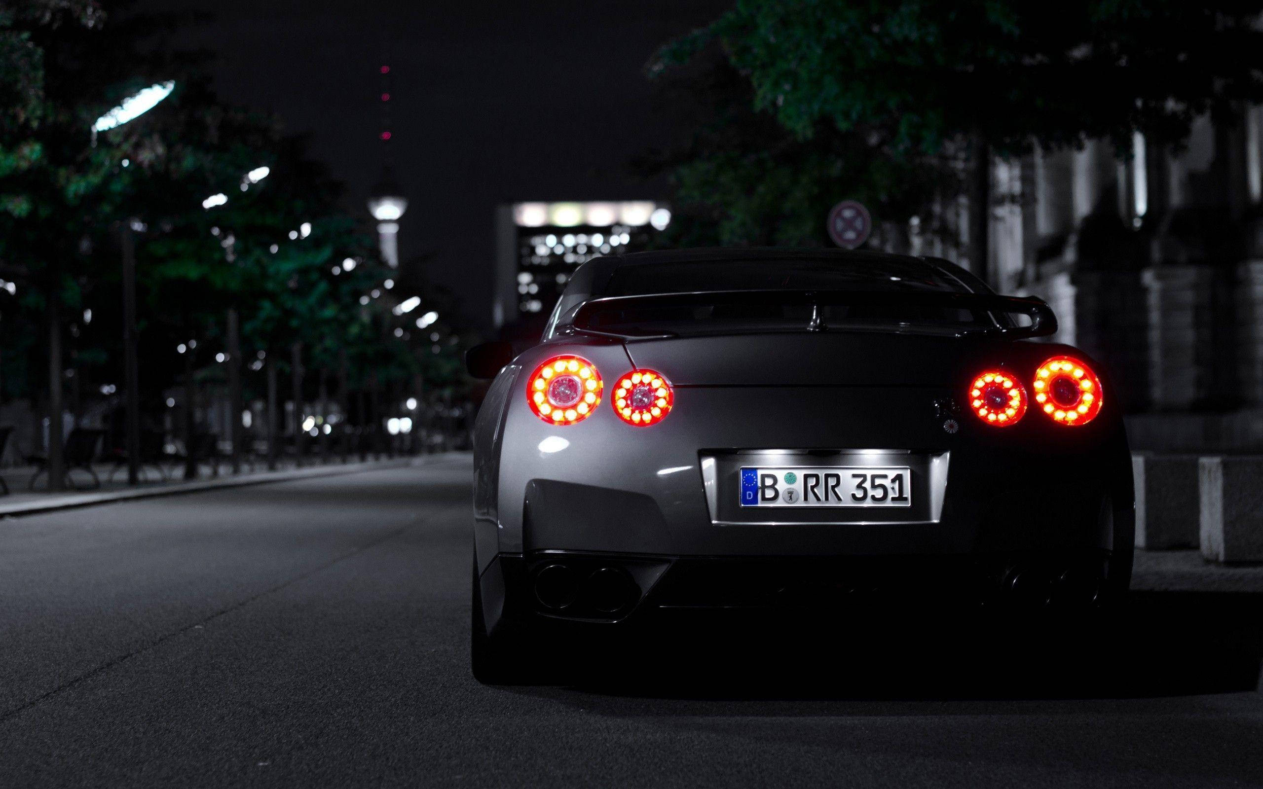 Nissan GTR, silver, glowing red circular taillights, 2K Desktop Wallpaper
