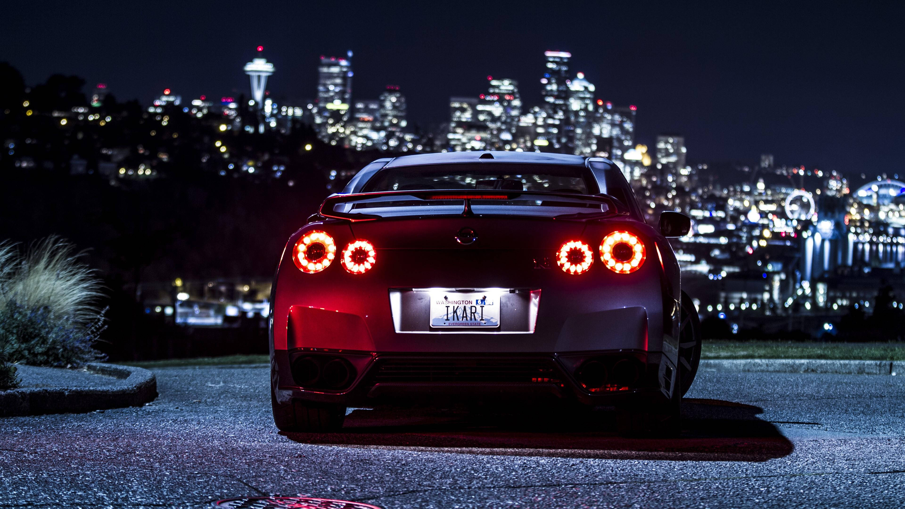 Nissan GTR, red sports car, glowing circular taillights, 4K Desktop Wallpaper