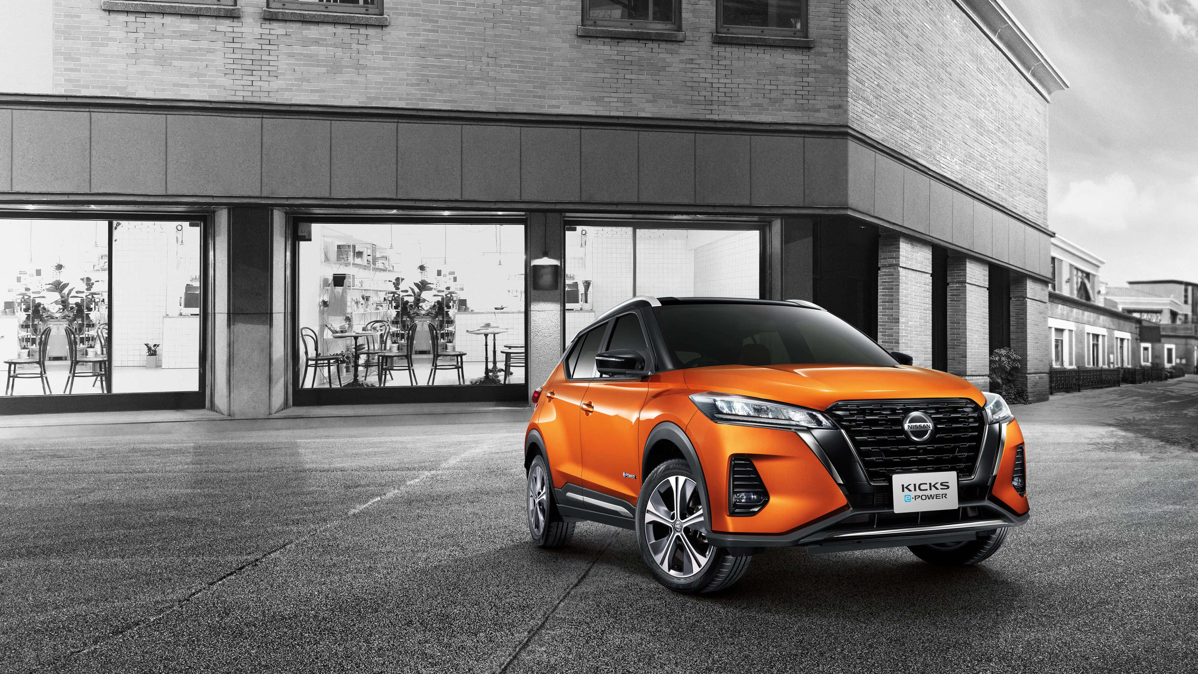 Nissan Kicks, vibrant orange, monochrome urban backdrop, 4K Desktop Wallpaper