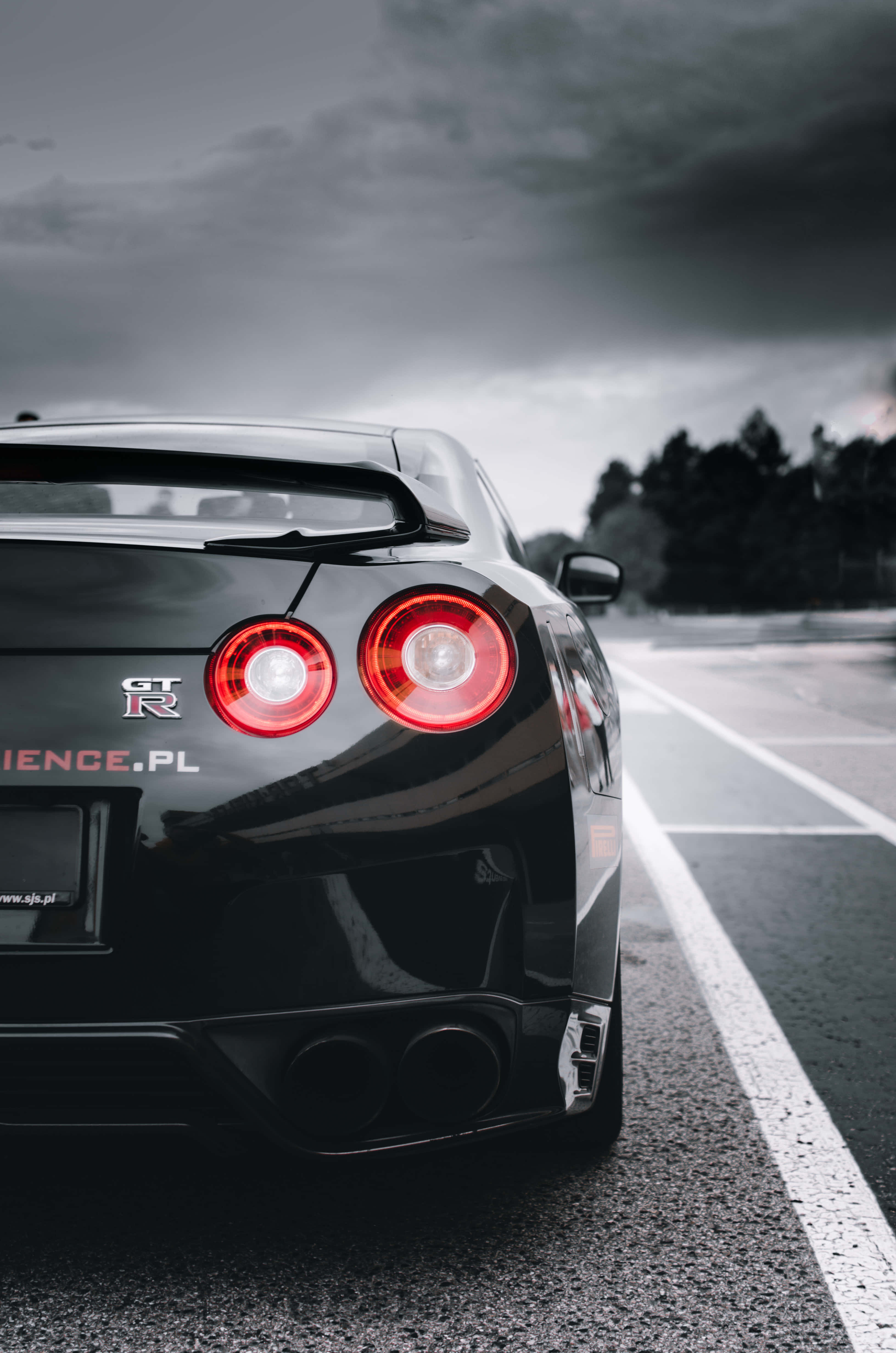 Nissan R35 Gtr, shiny black, glowing red taillights, 4K Phone Wallpaper