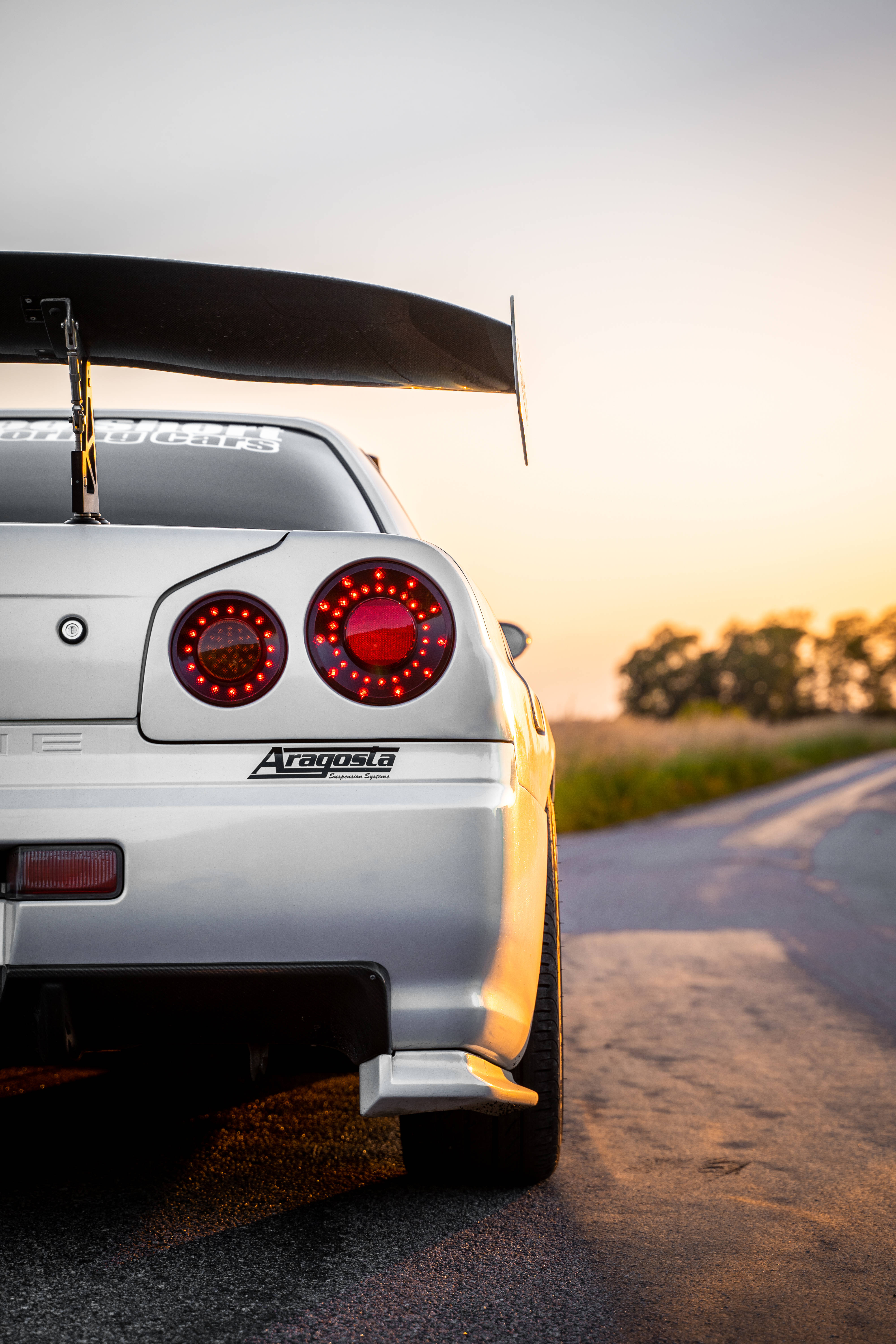 Nissan Skyline GTR R34, silver, glowing red taillights, 5K Phone Wallpaper