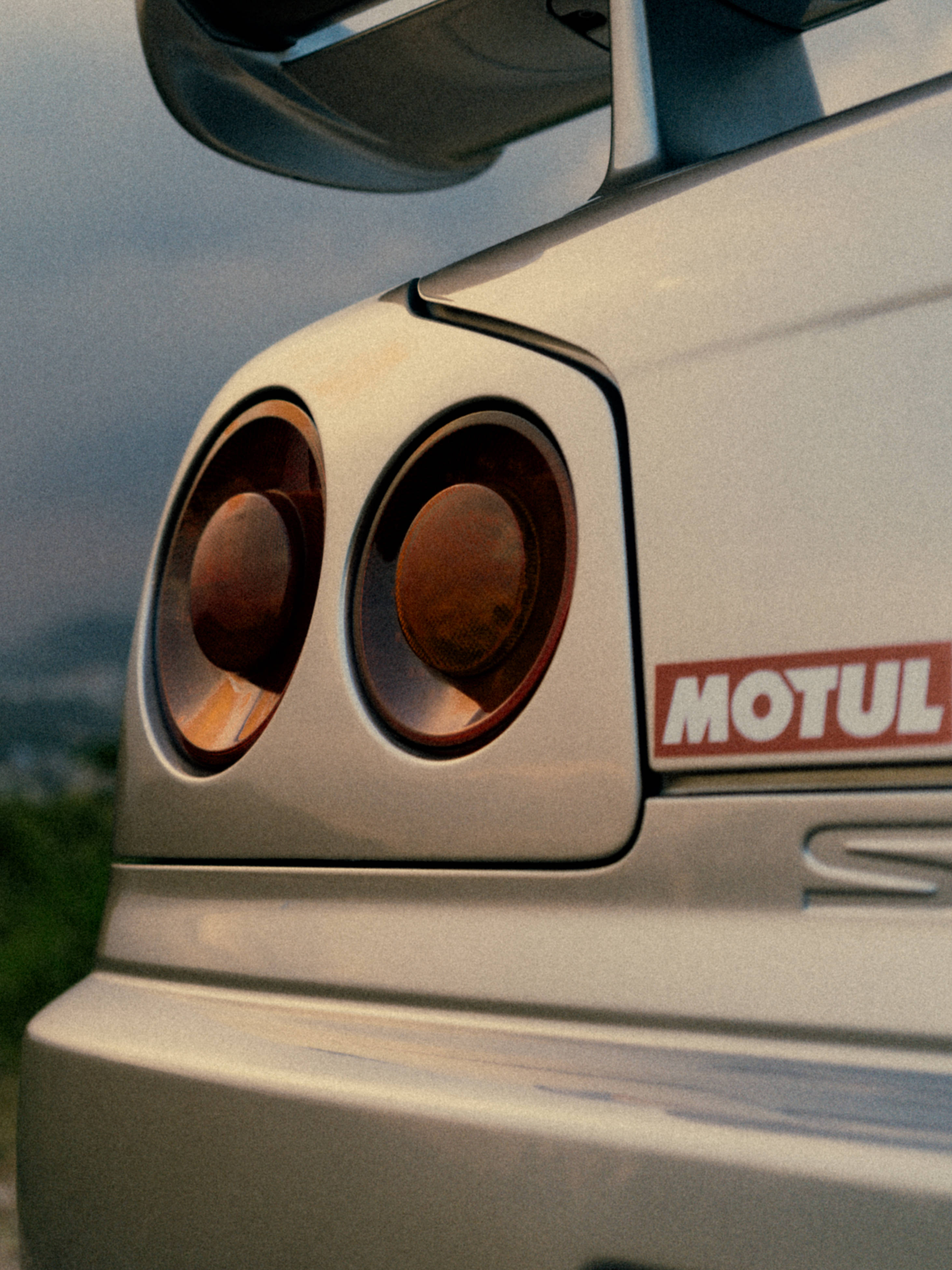 Nissan Skyline GTR R34, silica brass, amber taillights, 4K Phone Wallpaper