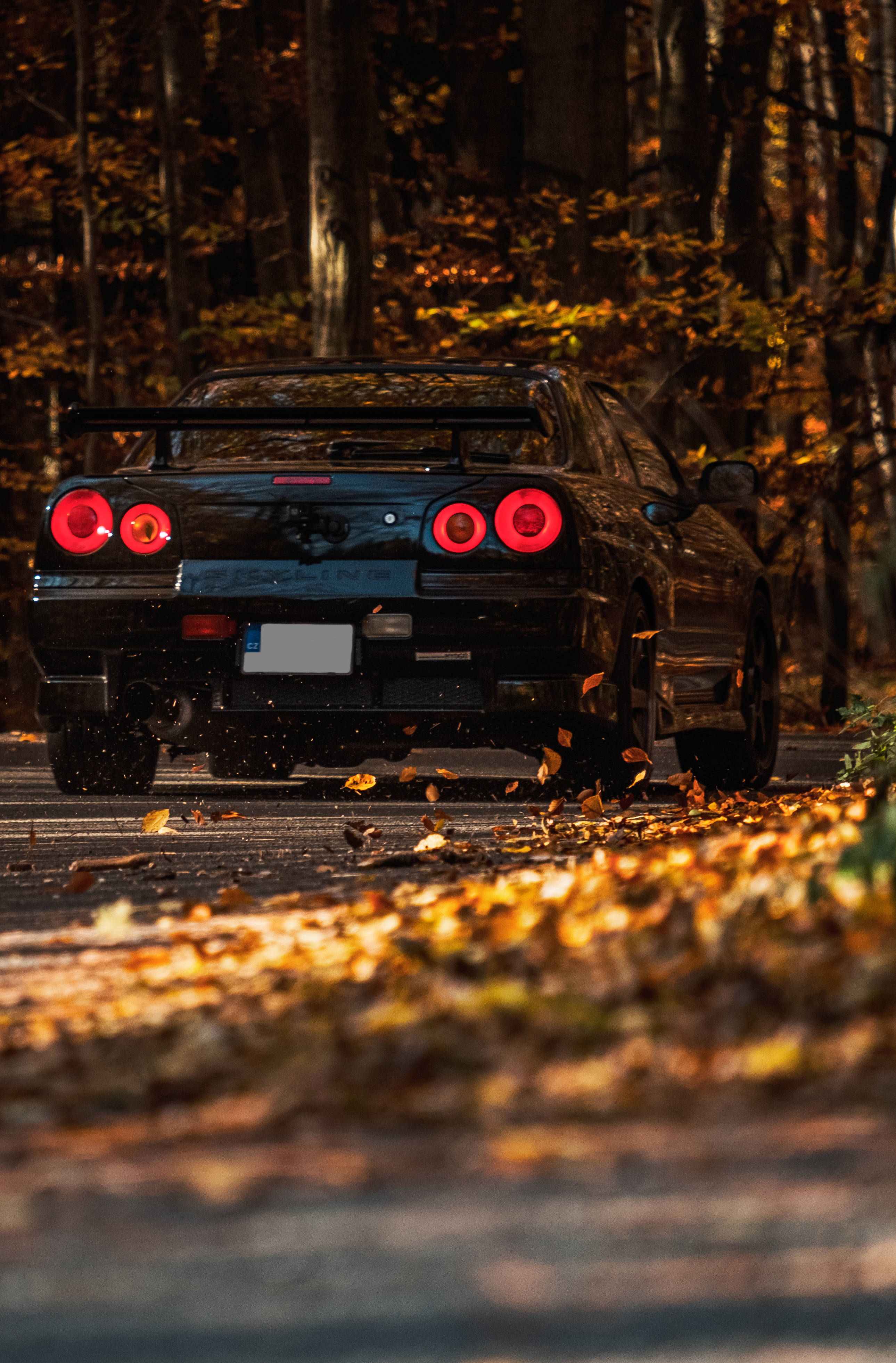 Nissan Skyline GTR R34, black, glowing red taillights, 4K Phone Wallpaper