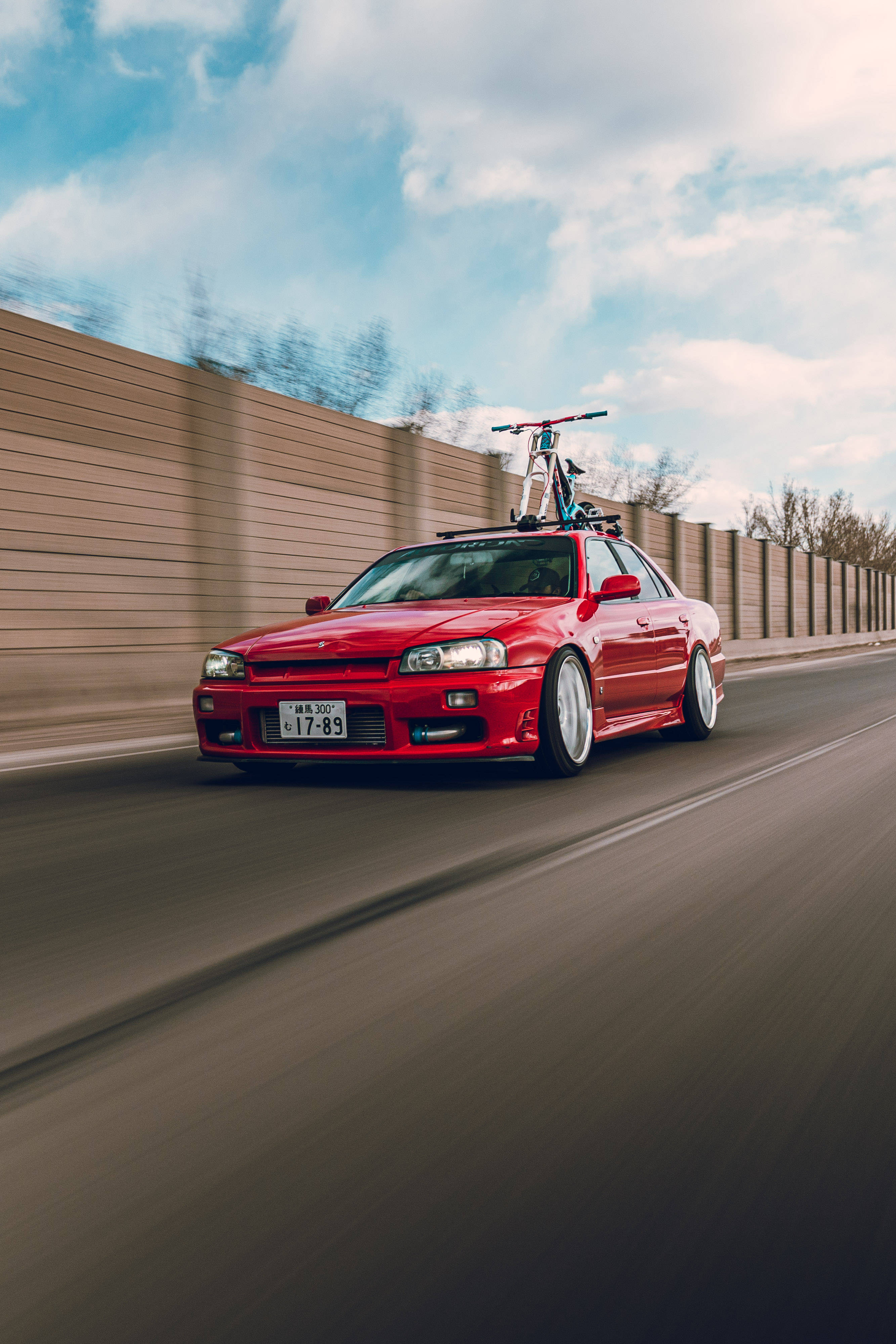 Nissan Skyline GTR R34, dashing red, highway, 4K Phone Wallpaper