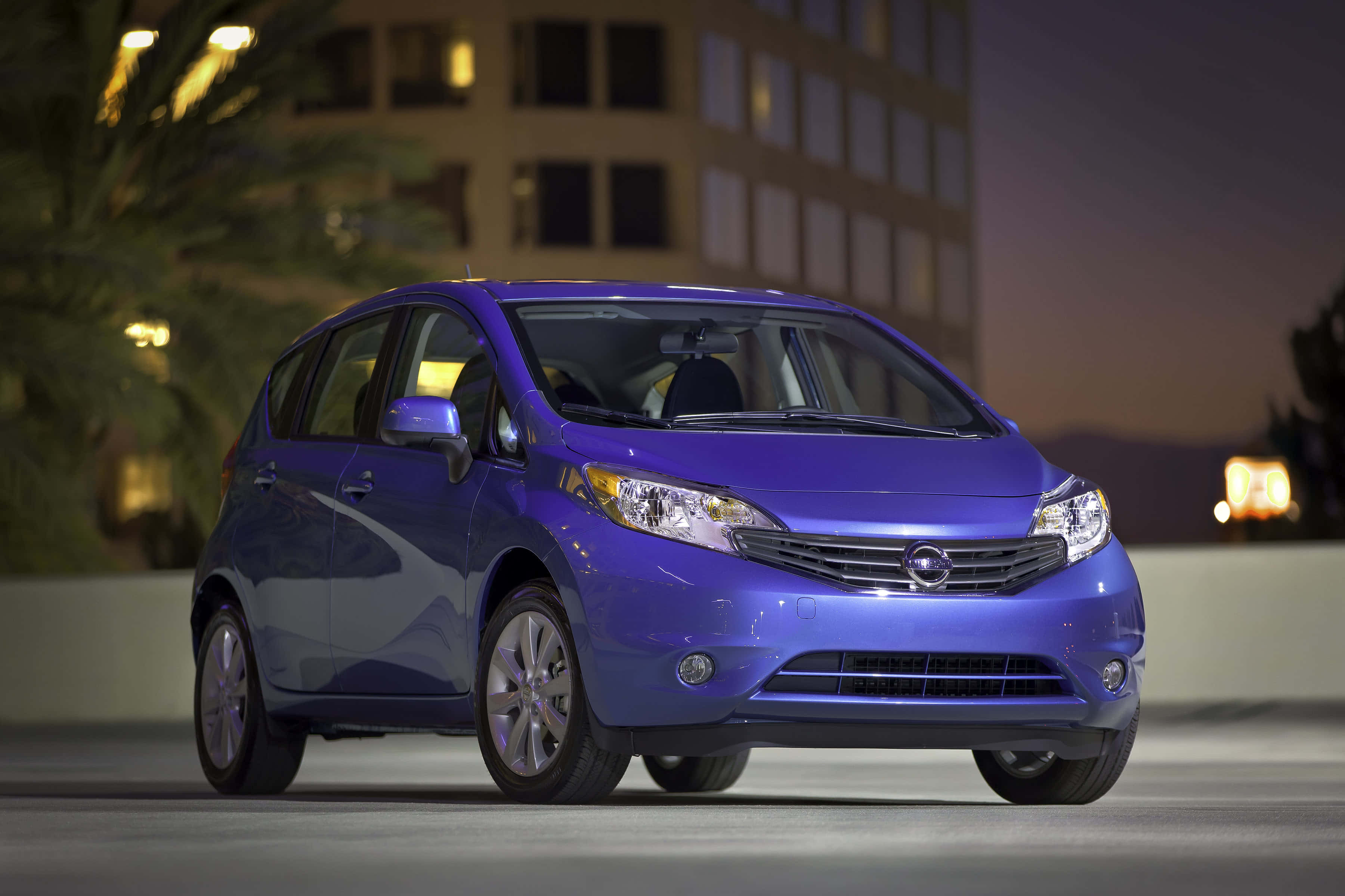 2021 Nissan Versa, glossy purple, city streets at night, 2K Desktop Wallpaper