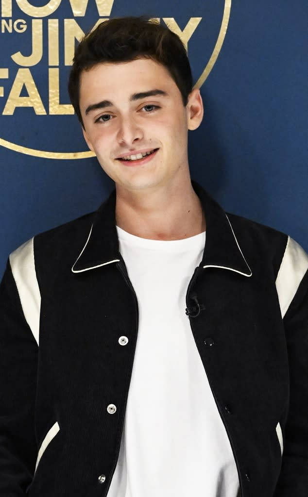 Noah Schnapp, black and white jacket, blue backdrop, SD Phone Wallpaper