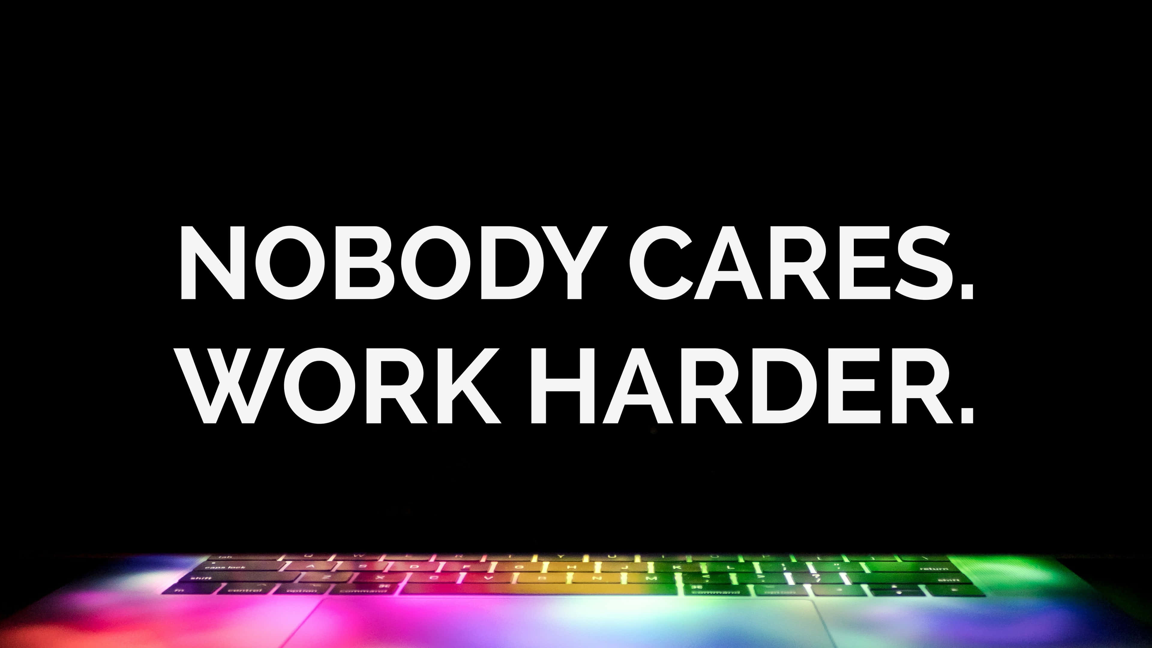 Nobody Cares Work Harder, white text, glowing rainbow keyboard, 4K Desktop Wallpaper