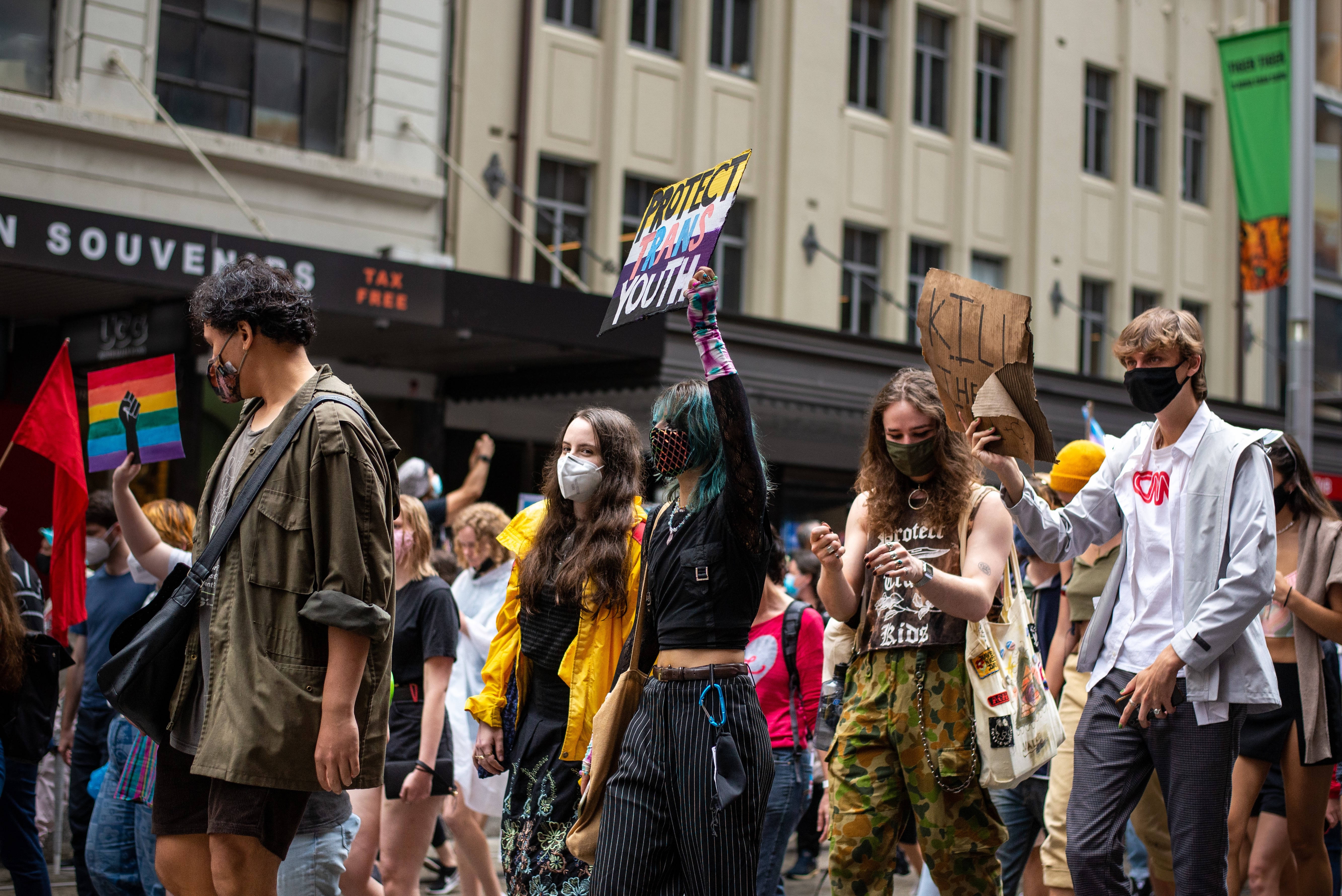Non-Binary, protesting, city street, 5K Desktop Wallpaper