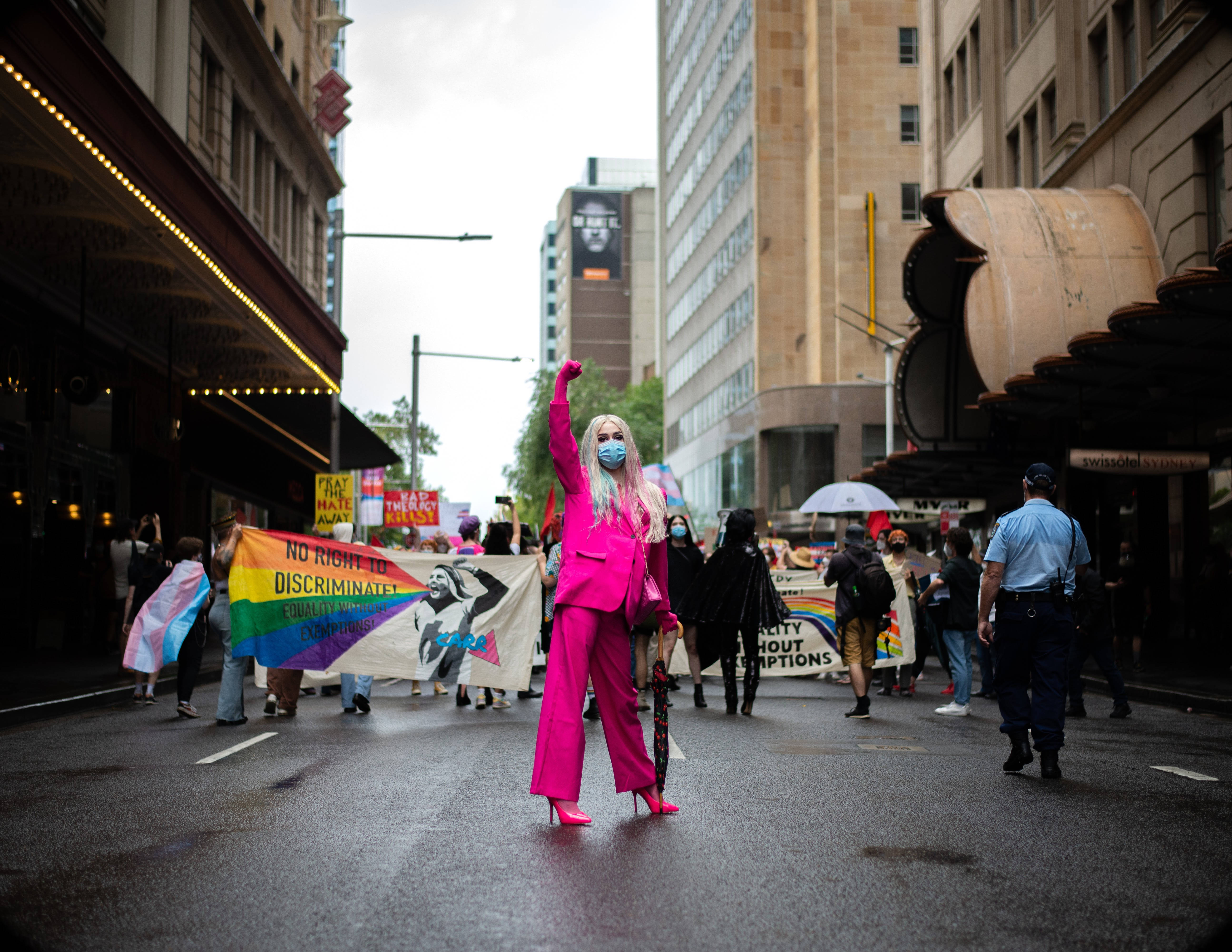 non binary person, bright pink suit, mask, 5K Desktop Wallpaper