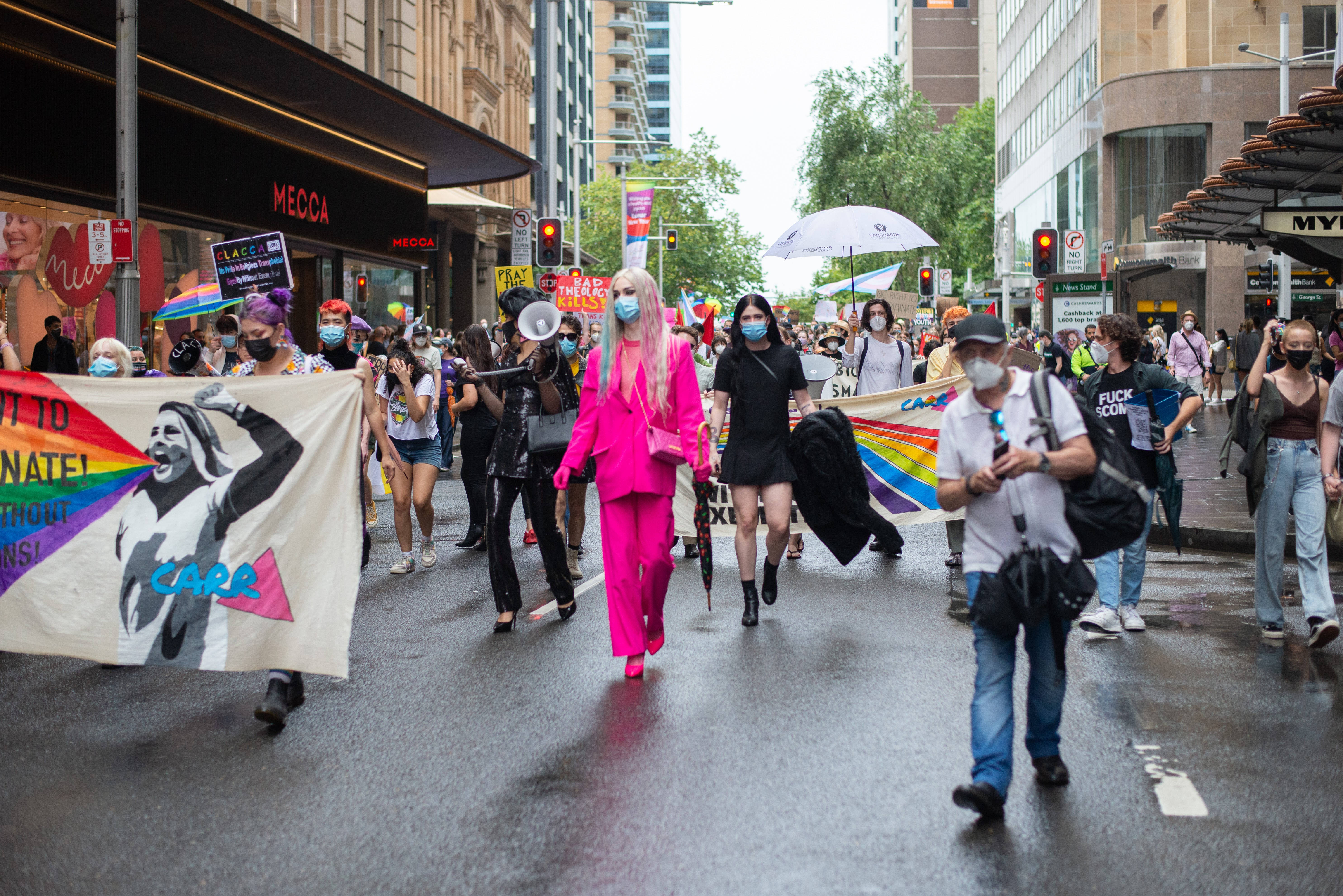 LGBTQ+ pride parade, rainbow flags, wet city street, 5K Desktop Wallpaper