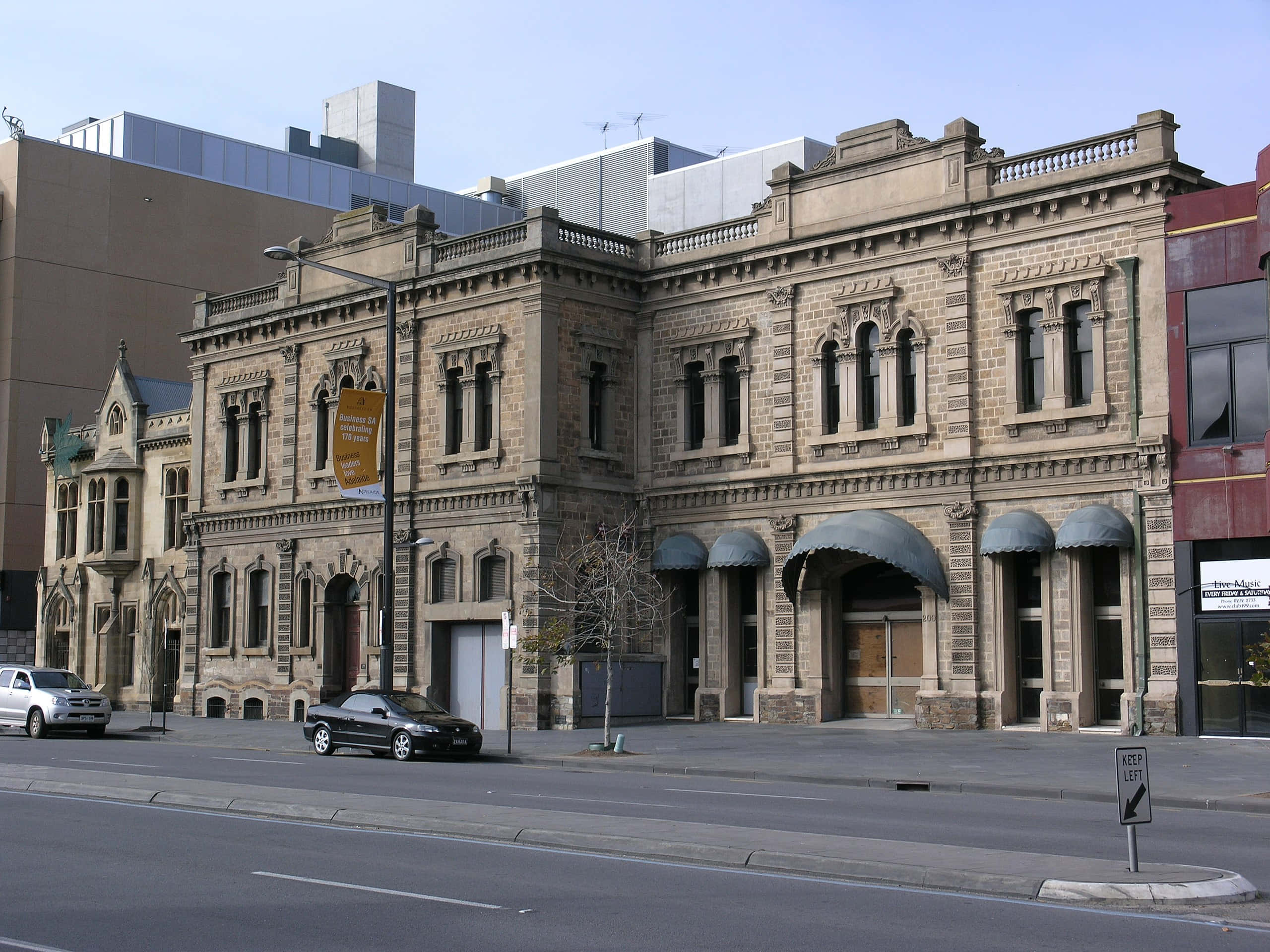 North Terrace Adelaide, historic stone building, arched windows, 2K Desktop Wallpaper