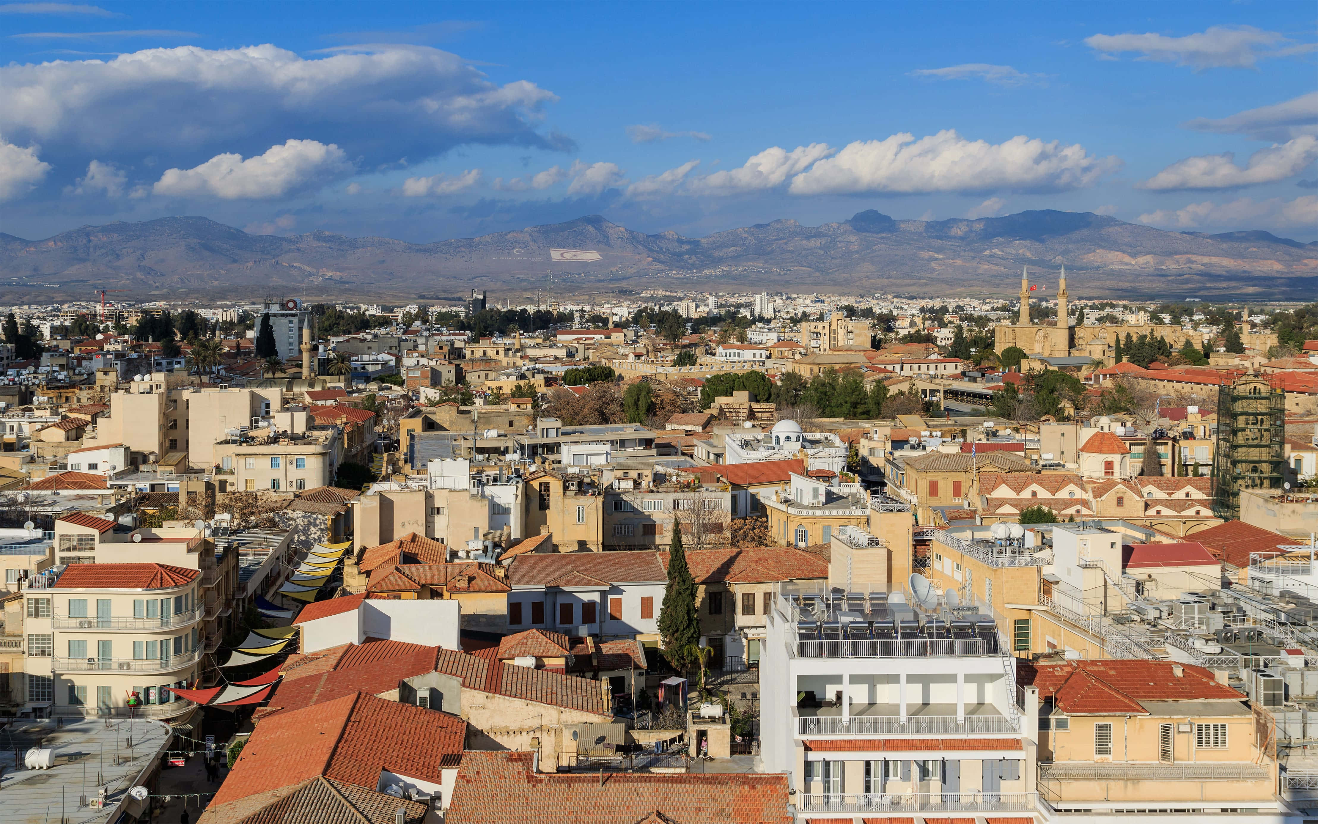 Northern Cyprus, terracotta rooftops, distant mountains, 4K Desktop Wallpaper