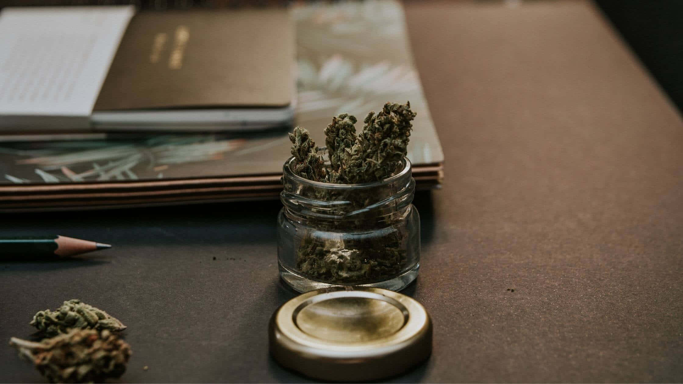 glass jar, dried cannabis buds, dark desk, Full HD Desktop Wallpaper