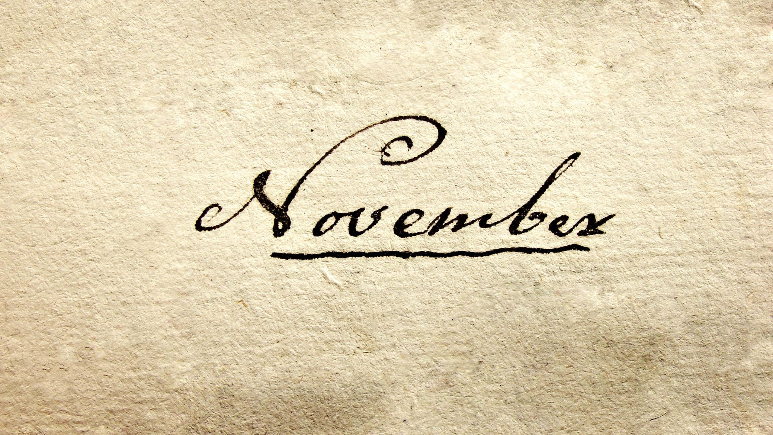 November, black ink, textured beige paper, 2K Desktop Wallpaper