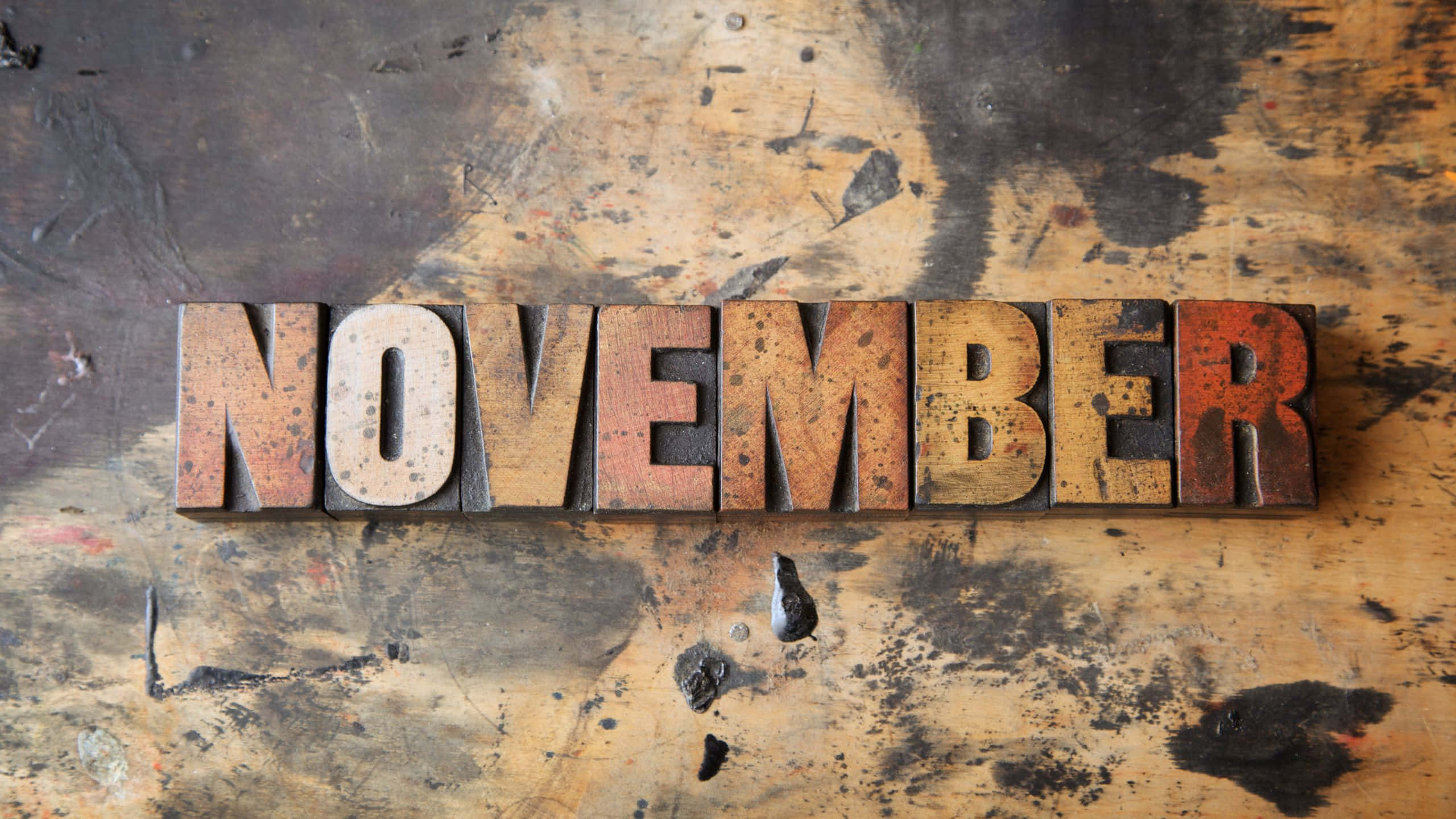 NOVEMBER, wooden letterpress blocks, stained rustic workbench, 2K Desktop Wallpaper