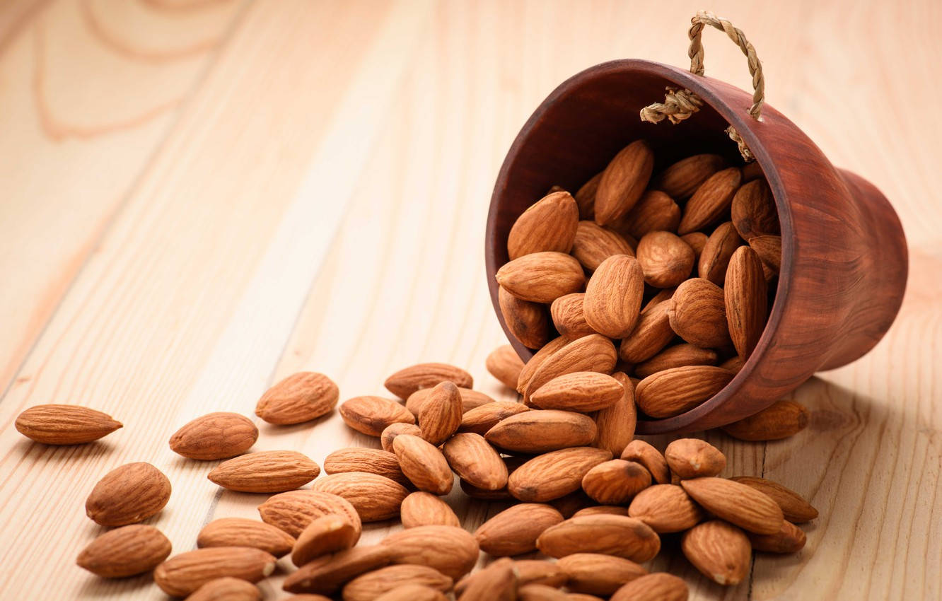 raw almond nuts, wooden bowl, light wood surface, HD Desktop Wallpaper