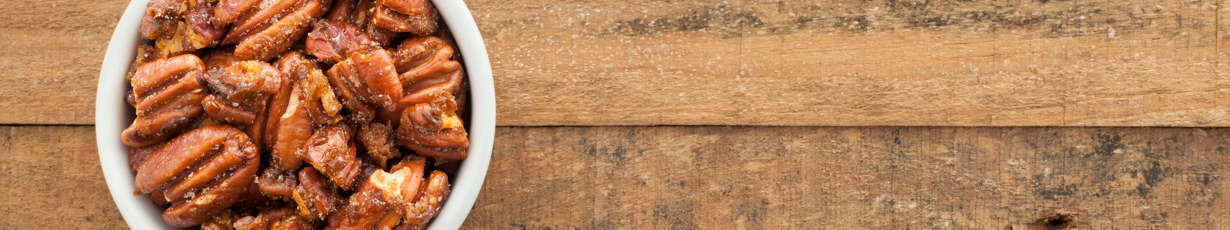 white bowl, glossy candied pecans, rustic wooden surface, 4K Desktop Wallpaper