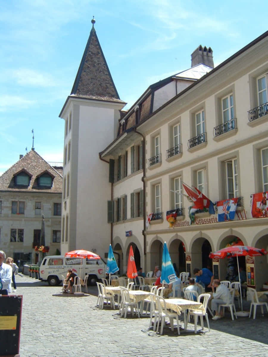 Nyon, Switzerland, cobblestone pavement, outdoor café tables, SD Phone Wallpaper