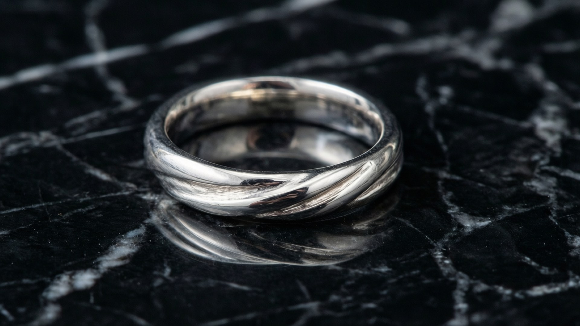 silver twisted band ring, glossy black marble surface, white veining, Full HD Desktop Wallpaper