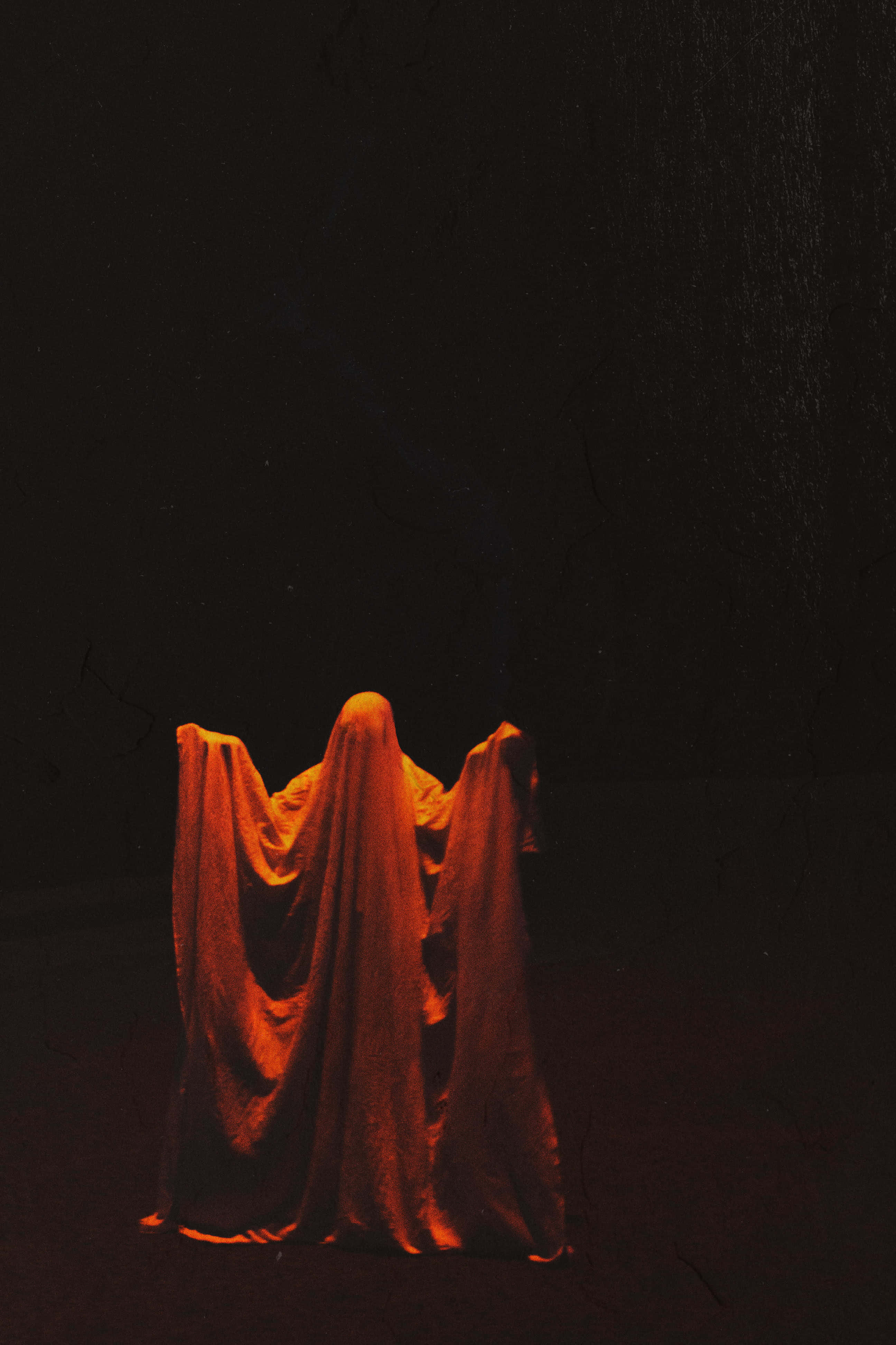 Occult, glowing orange fabric, cracked wall, 4K Phone Wallpaper