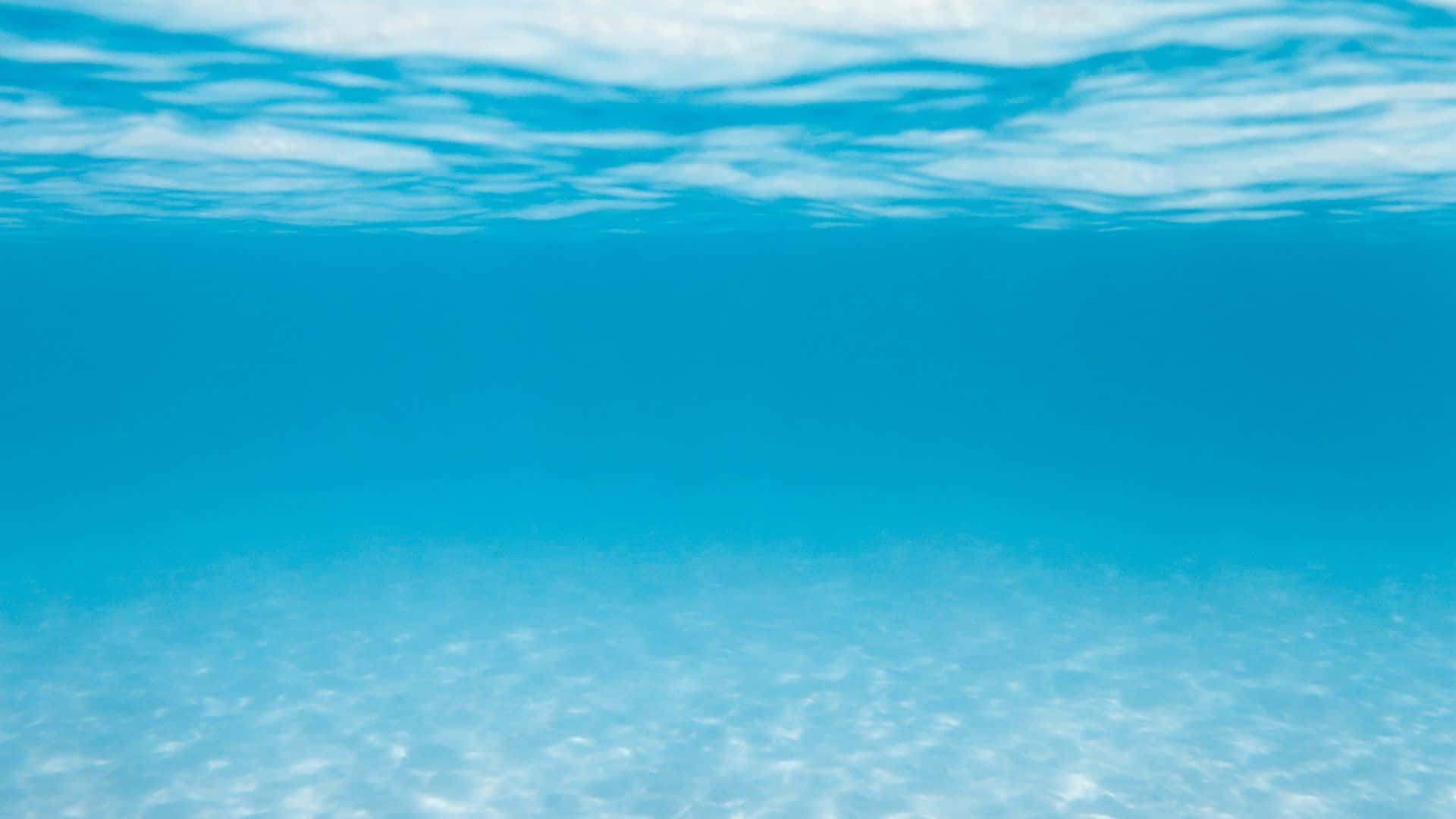 turquoise ocean, sunlight filtering through rippling surface, sandy bottom, Full HD Desktop Wallpaper