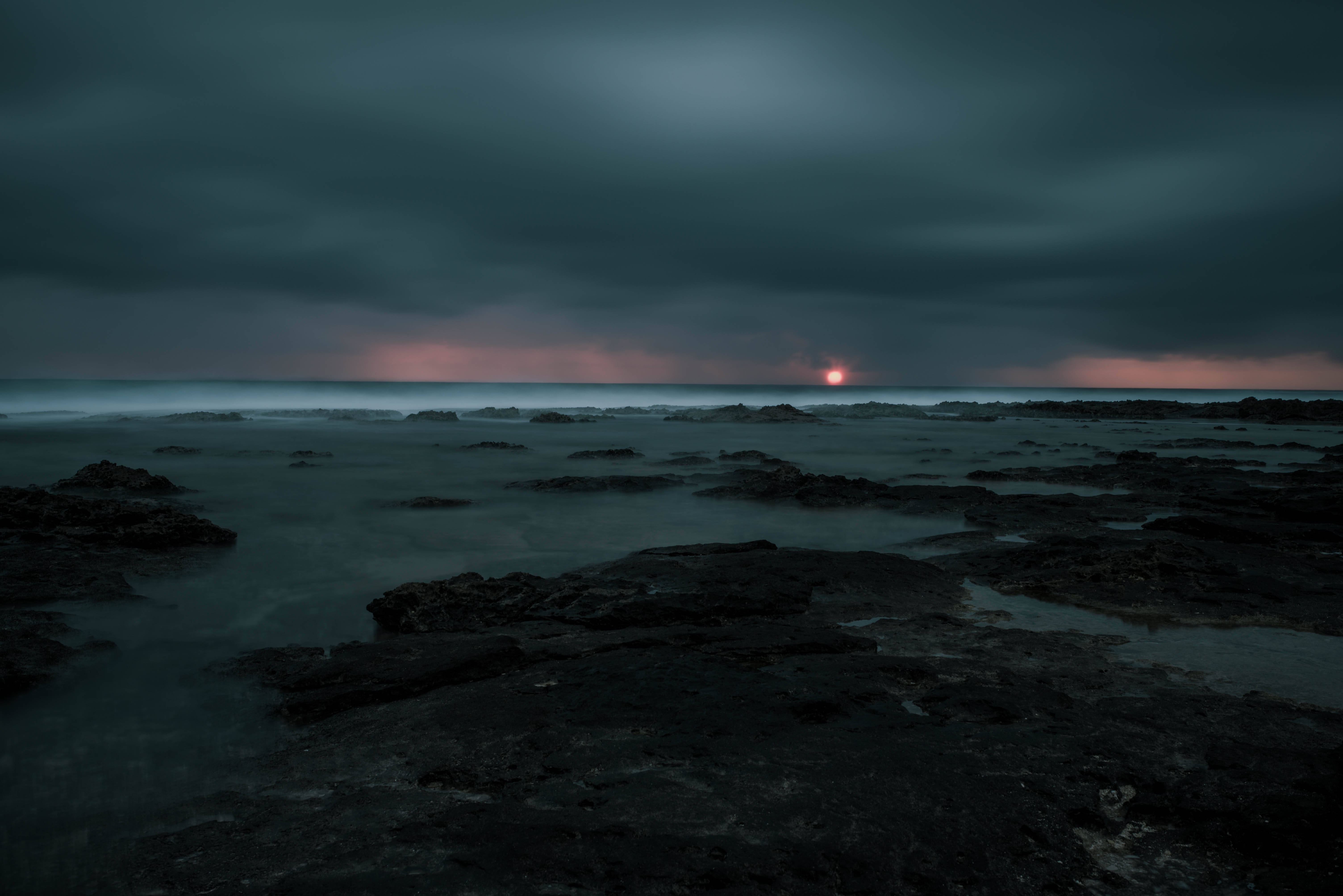 Storm At Sea, sunset horizon, dark rocks, 5K Desktop Wallpaper