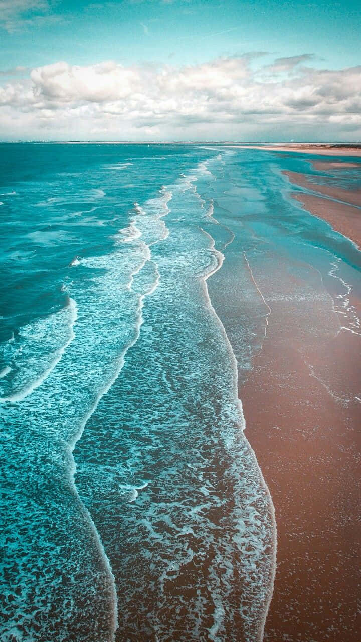 turquoise waves, reddish-brown sandy beach, partly cloudy sky, HD Phone Wallpaper