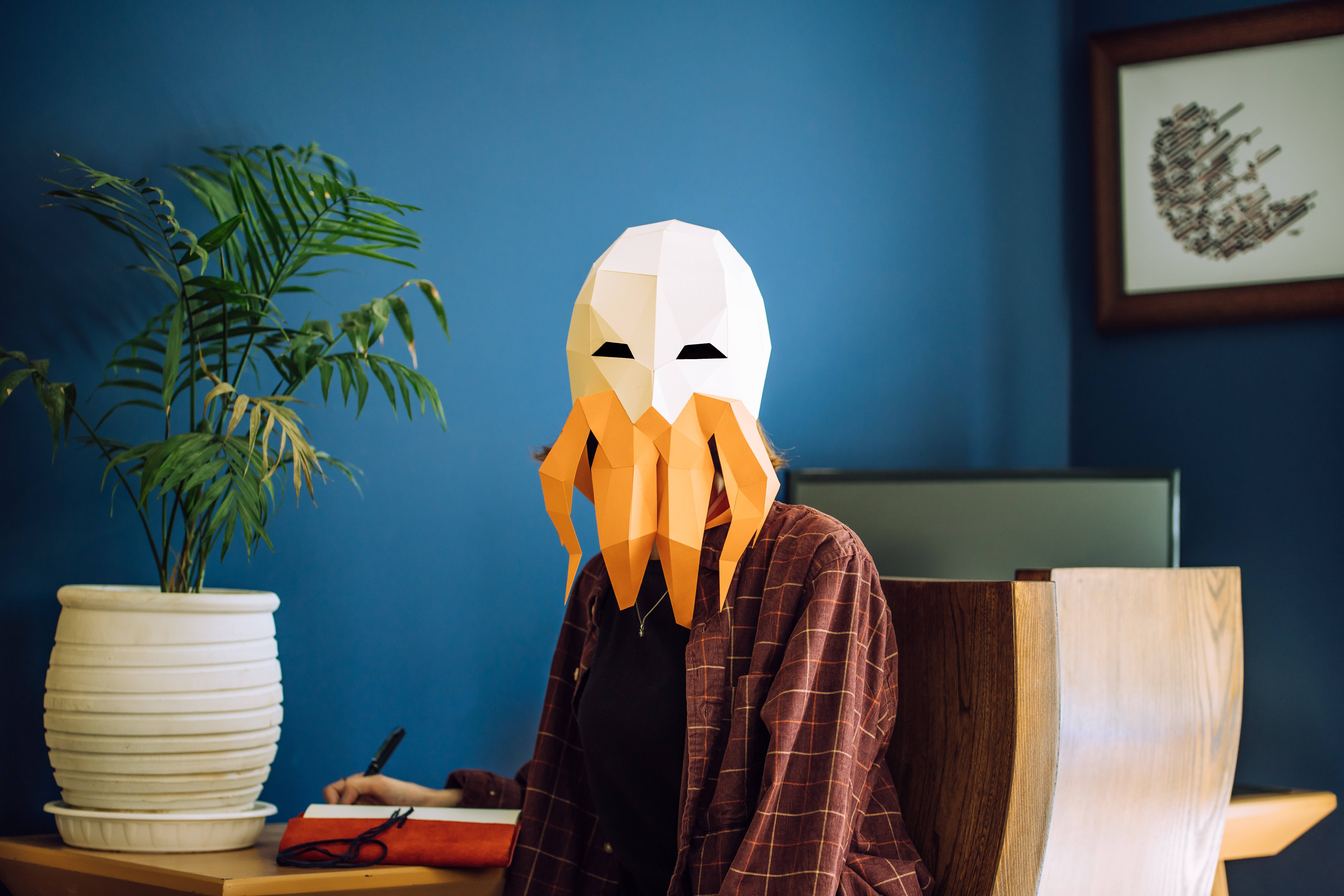 octopus mask, geometric octopus mask, wooden desk, 8K Desktop Wallpaper