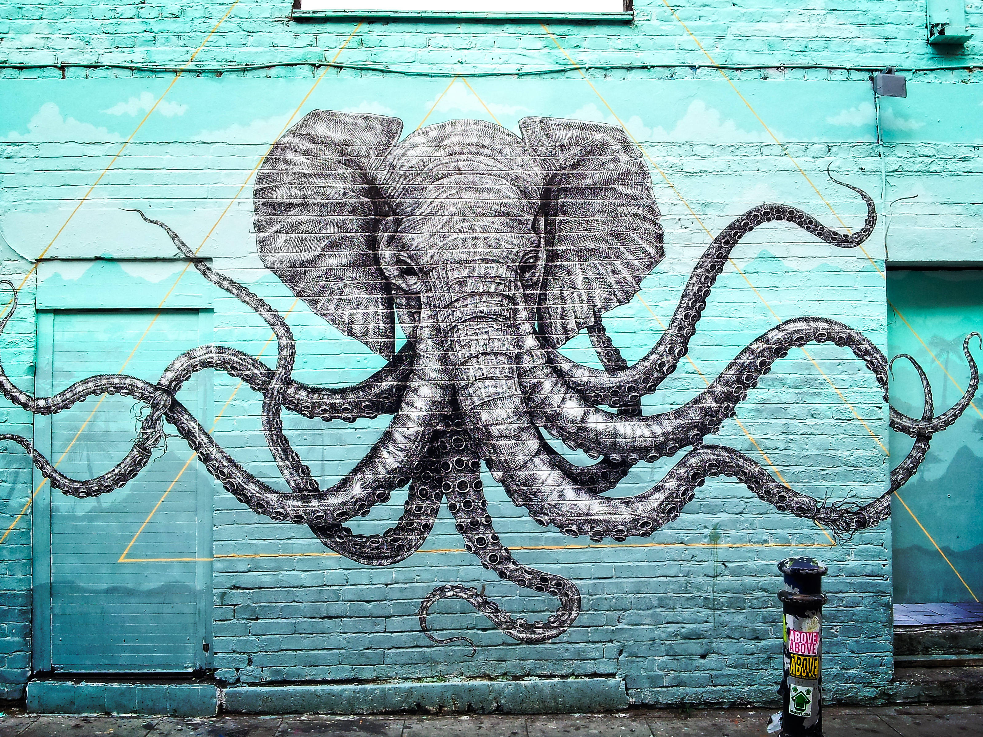 elephant-headed octopus, turquoise brick wall, black and white mural, 2K Desktop Wallpaper