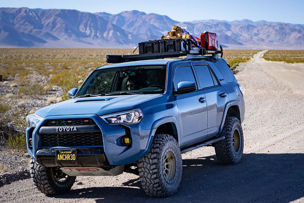 blue Toyota 4Runner, oversized tires, rooftop gear, SD Desktop Wallpaper