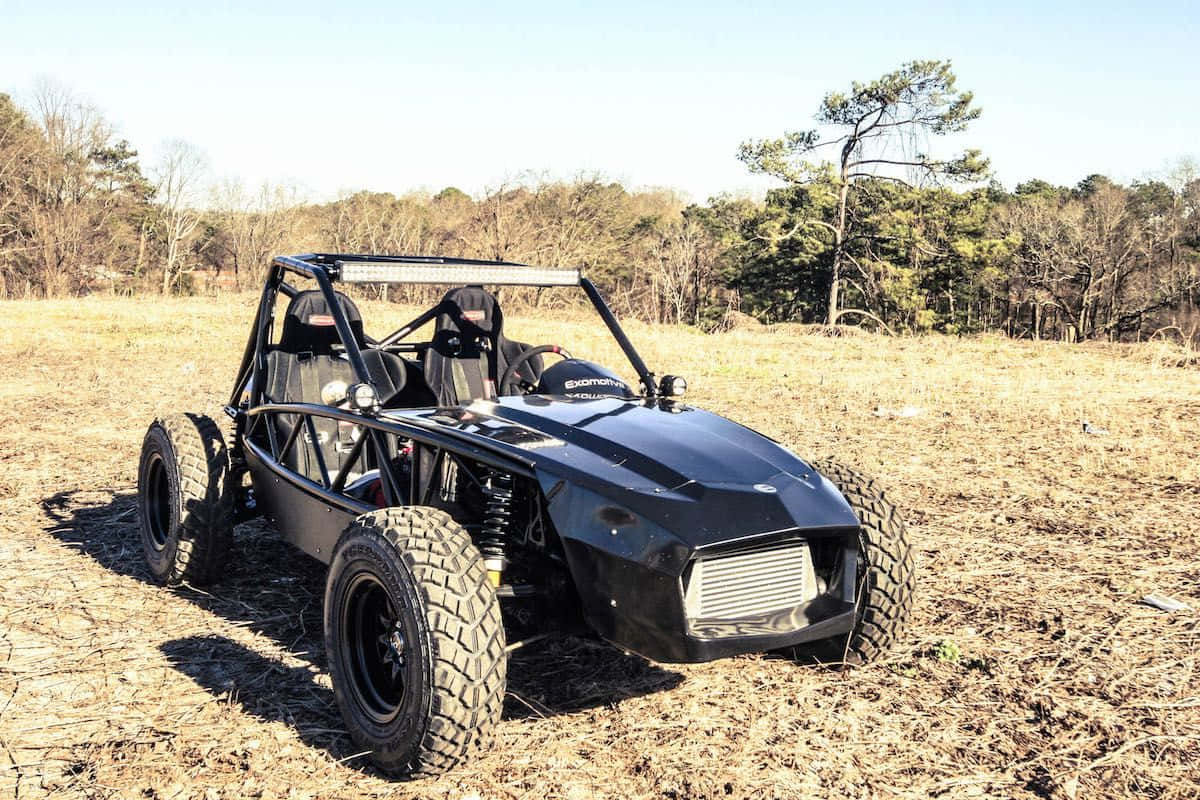 black off-road dune buggy, large tires, dry grass, SD Desktop Wallpaper